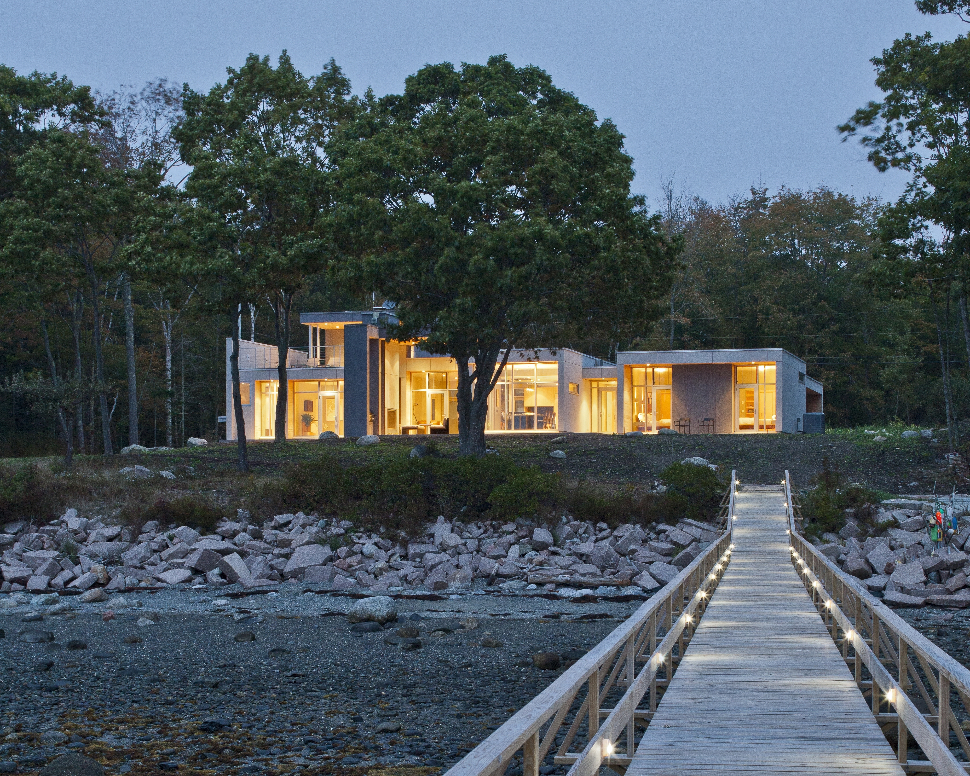 The Dennises’ sleek home won’t have a high-maintenance lawn but native plantings; plenty of outdoor space and windows with uninterrupted views were paramount.