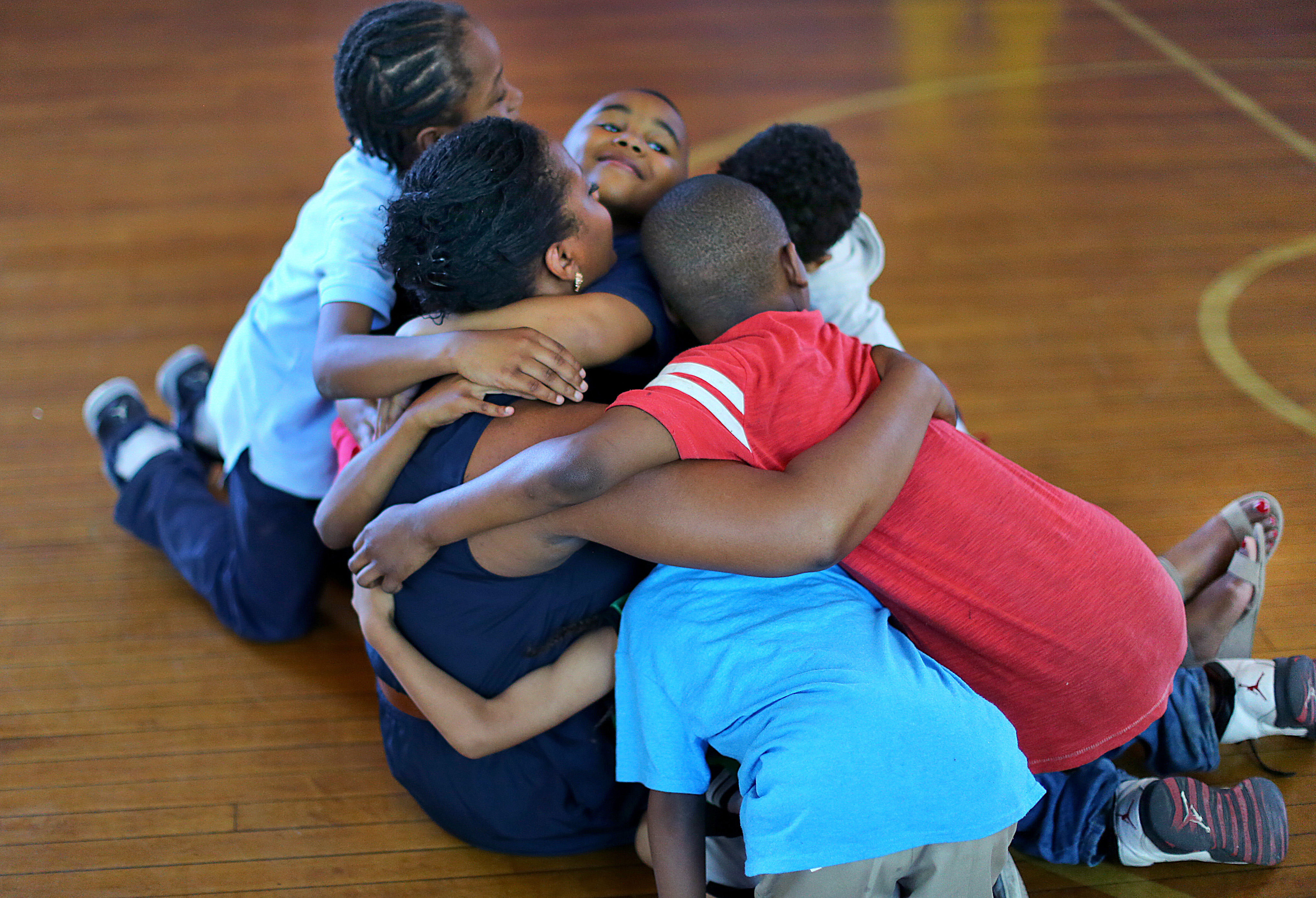 Janelle Ridley got a hug from the students in the boxing program.