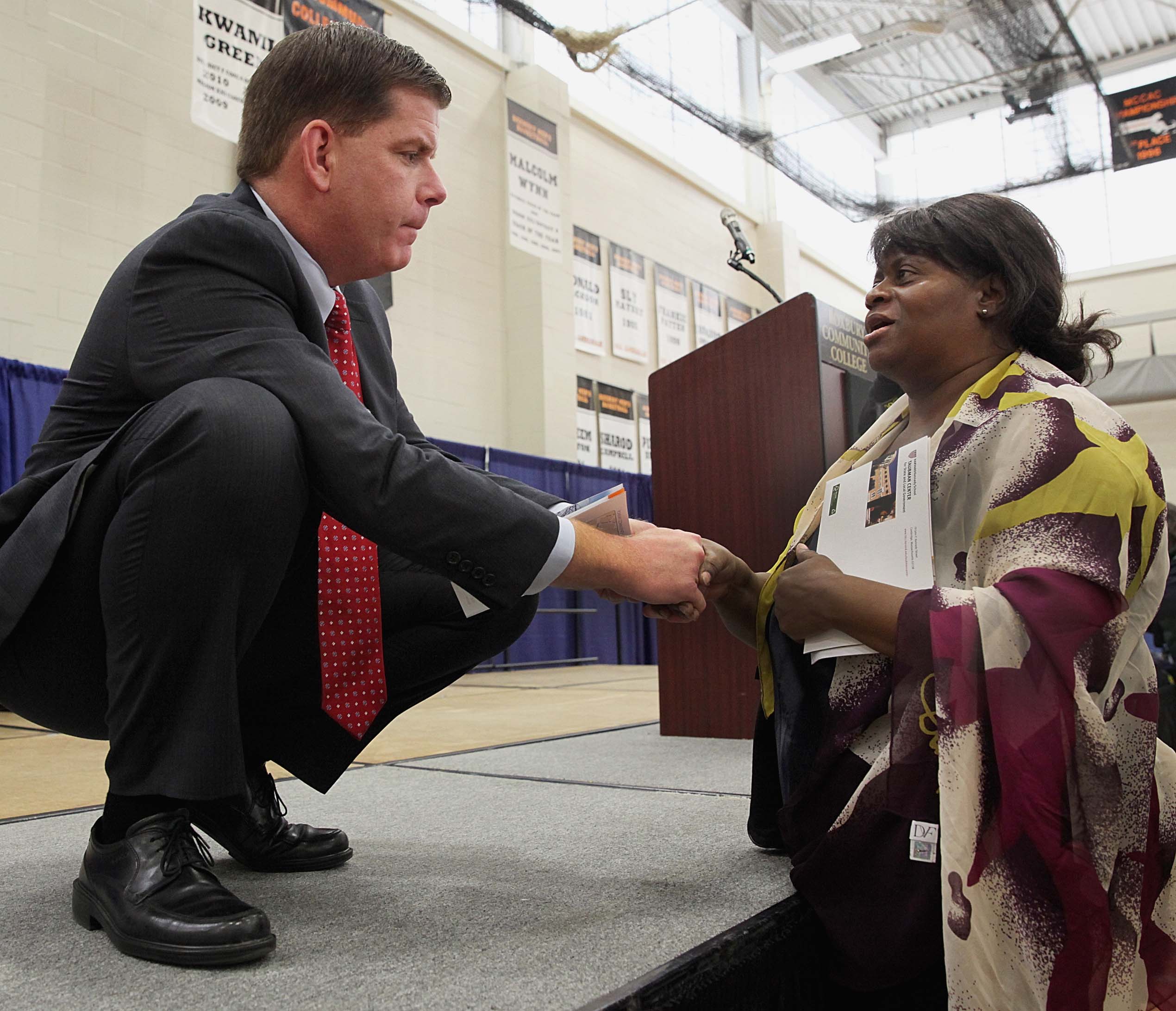 Boston mayor-elect Martin J. Walsh chatted with Brenda Velez during a town hall meeting Saturday at the Reggie Lewis Track and Athletic Center in Roxbury.