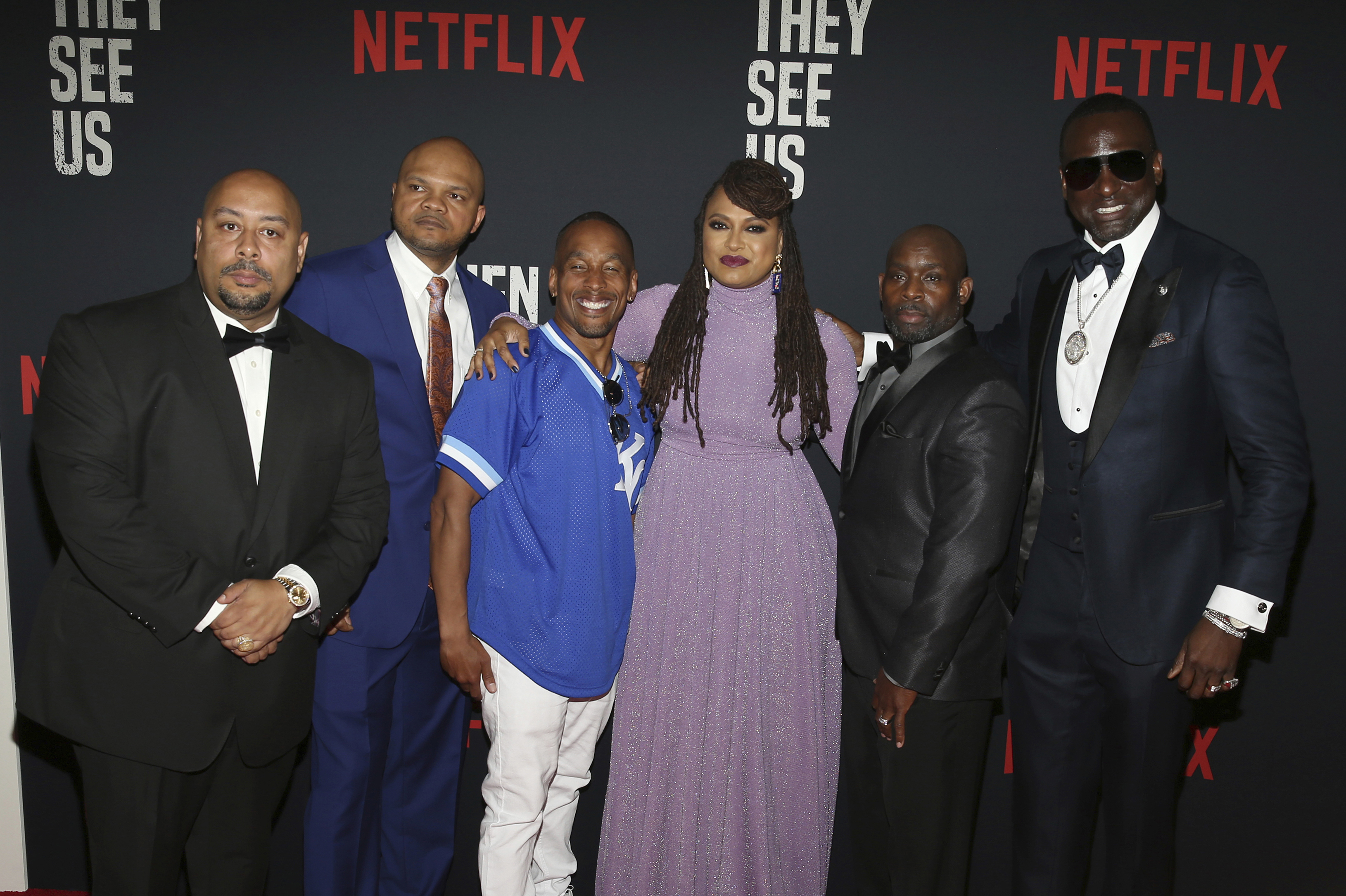 Director Ava DuVernay (center) with the Central Park 5: From left, Raymond Santana, Kevin Richardson, Korey Wise, Antron McCray and Yusef Salaam, attended the world premiere of "When They See Us," at the Apollo Theater in New York.