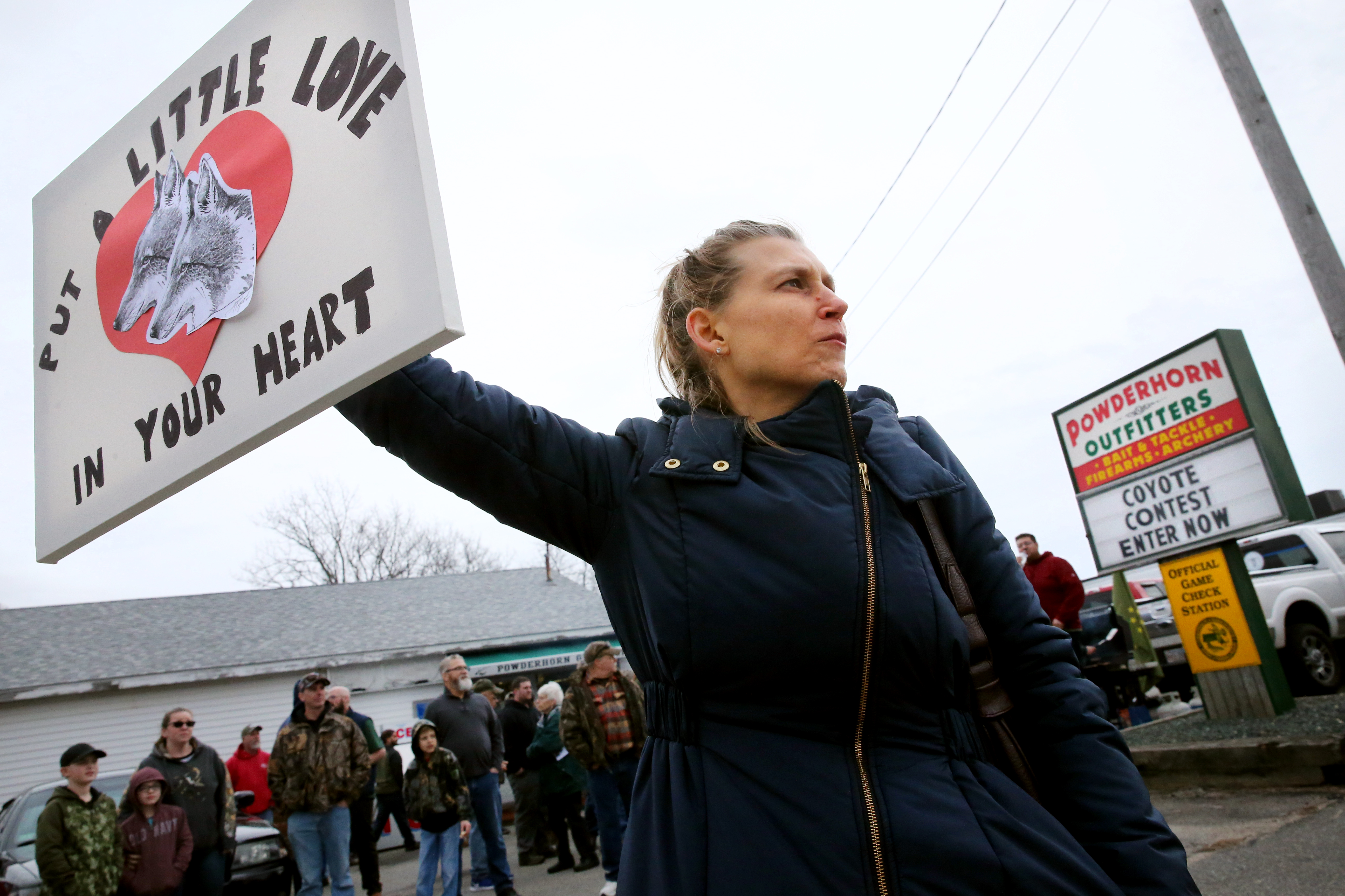 Kara K. Duff, of Brewster, expressed her opinion during a protest outside Powderhorn Outfitters.
