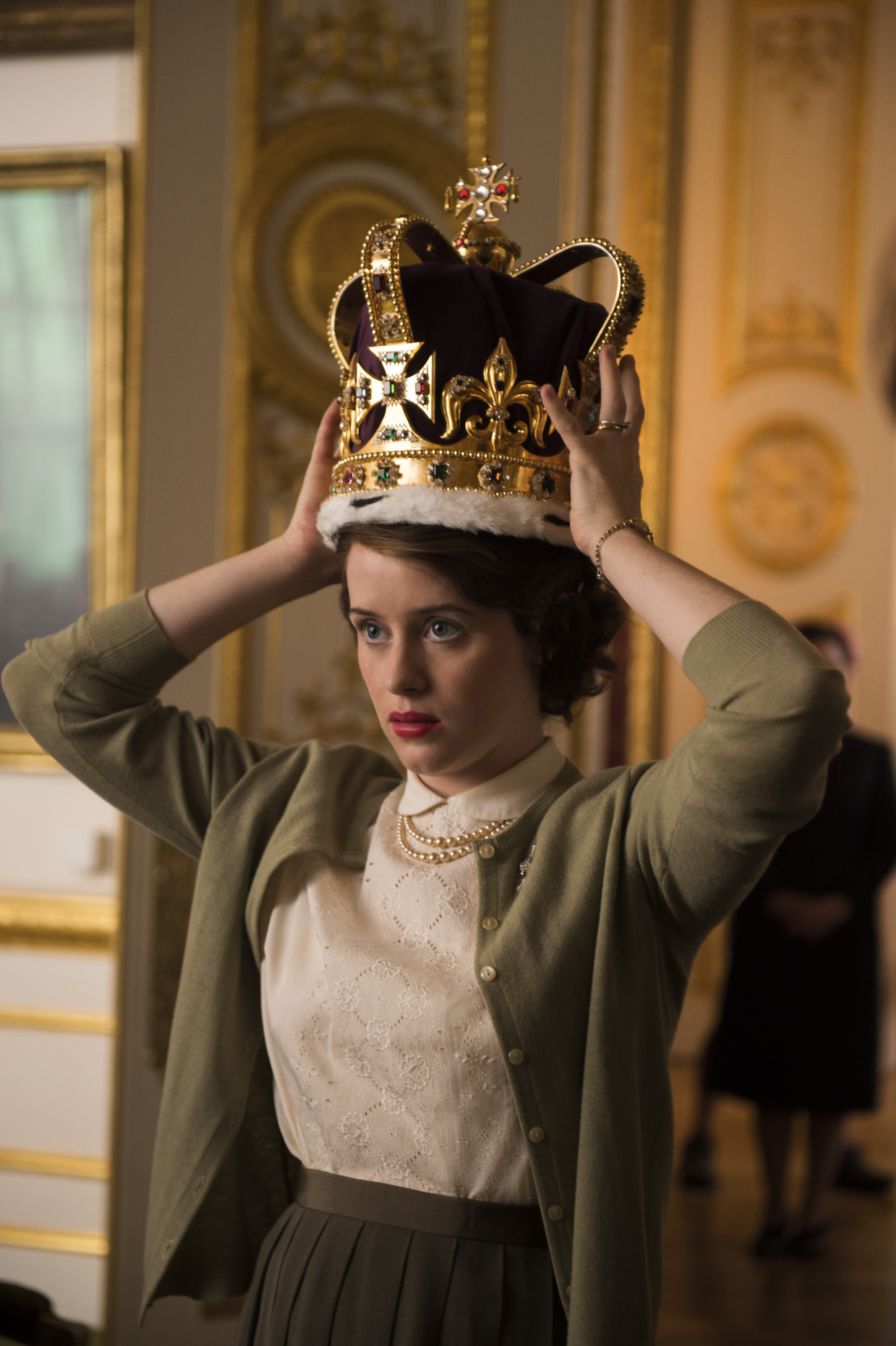 Claire Foy plays a young Queen Elizabeth in “The Crown.”