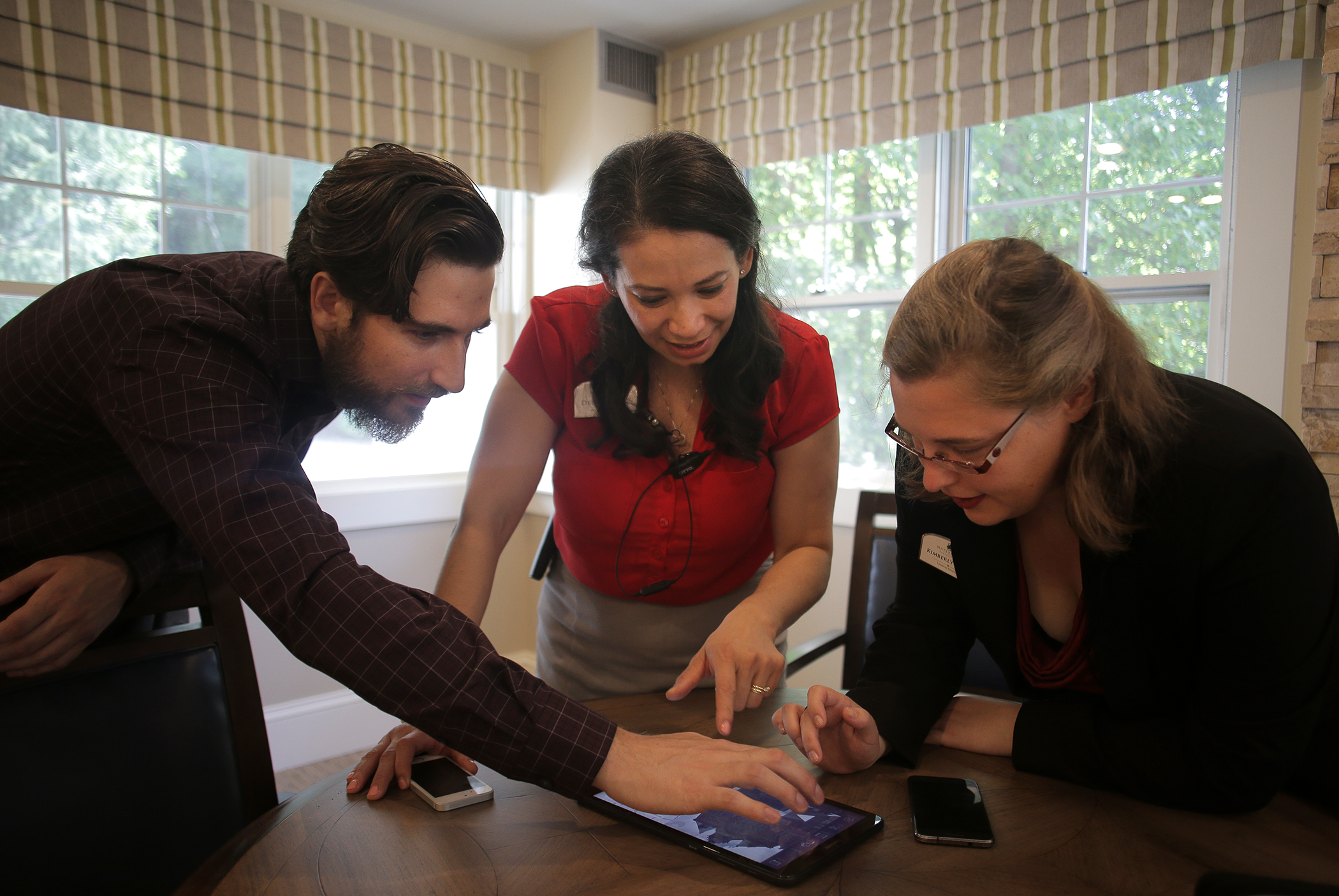 Tom Neumann, cofounder and CTO of Rendever; Delmy Flagg, memory care director at Maplewood; and Kimberly Davie, lifestyle director at Maplewood, chose virtual locations for the seniors.