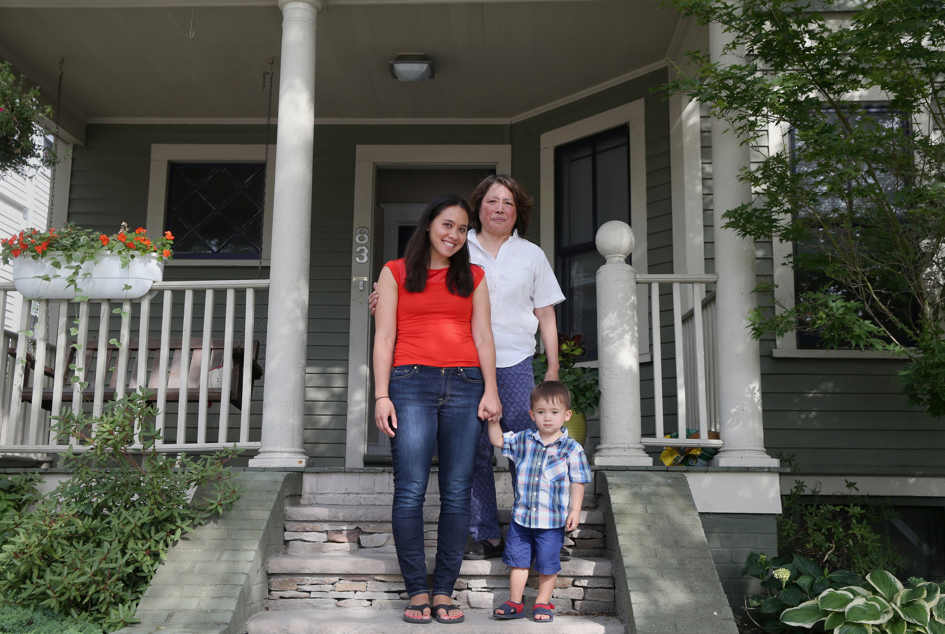 From left, Stephanie Heckman, her mother, Gertrudes Euler, and her son, James Heckman, 2, in front of their Somerville home, where they live in tandem condos.