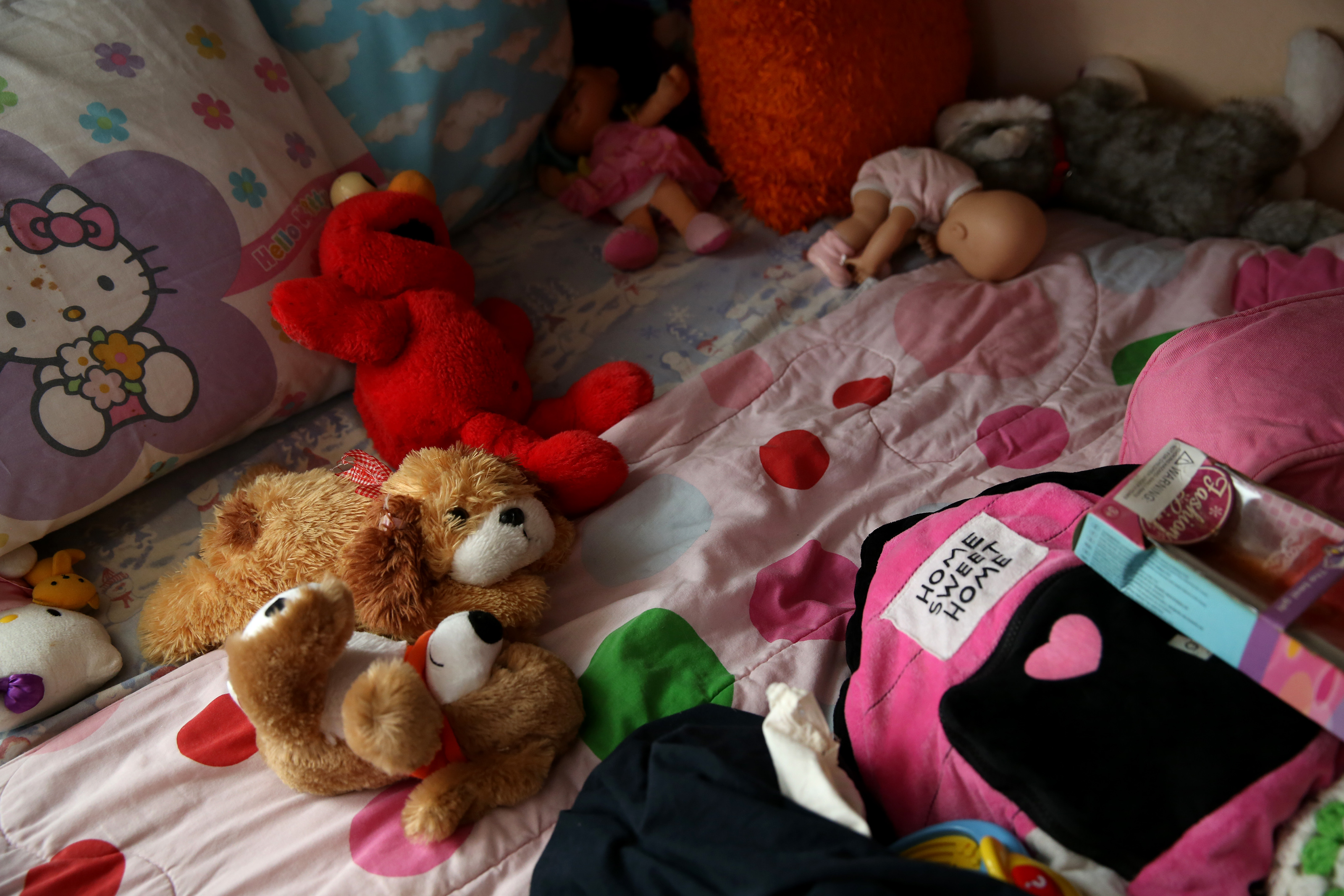 Stuffed animals lay on her daughter’s bed at Cynthia’s home. The DCF took her children into custody over a variety of concerns, some involving the children’s father.