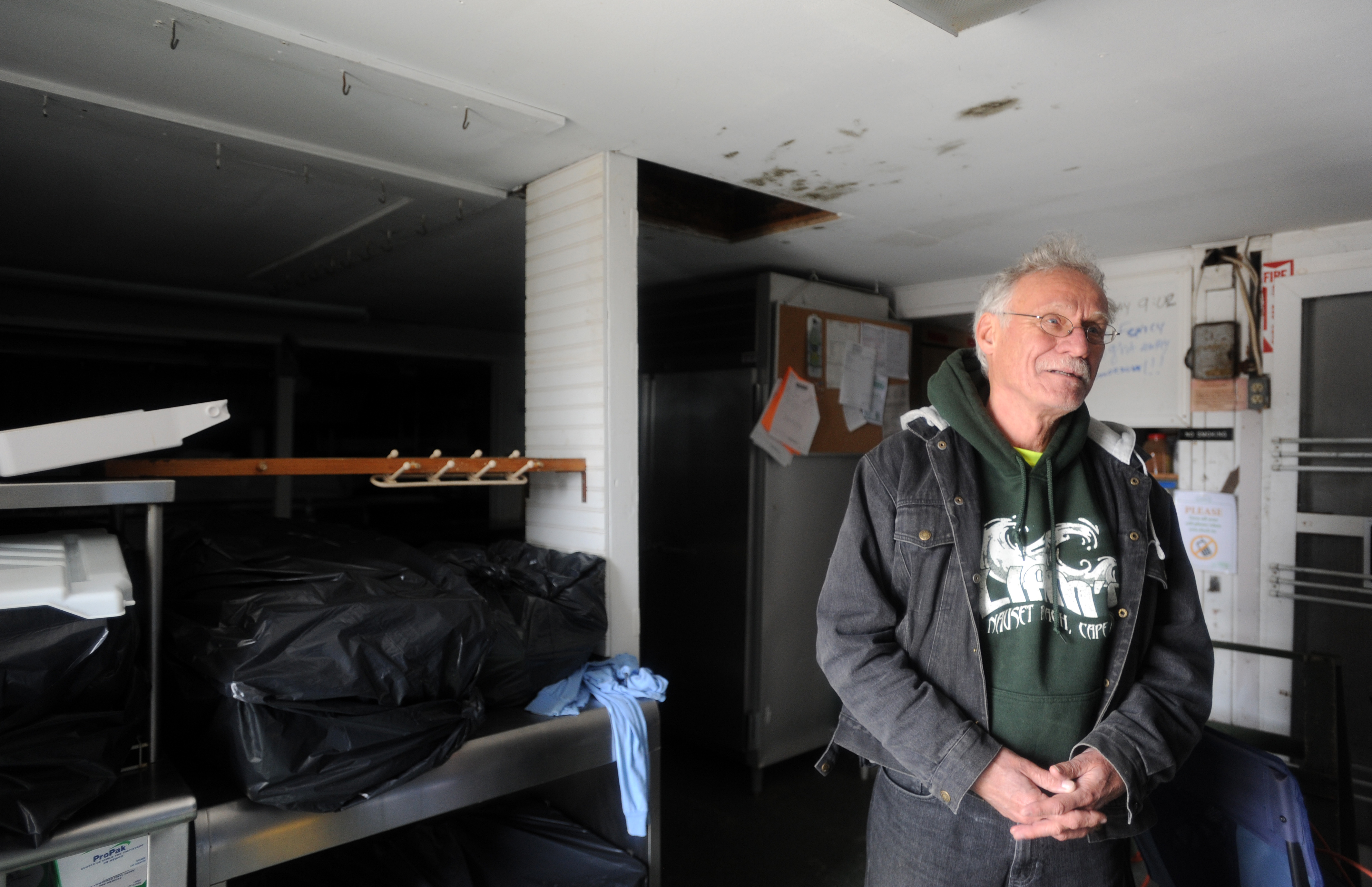 John Ohman took items out of the snack shack on Monday after the storm.