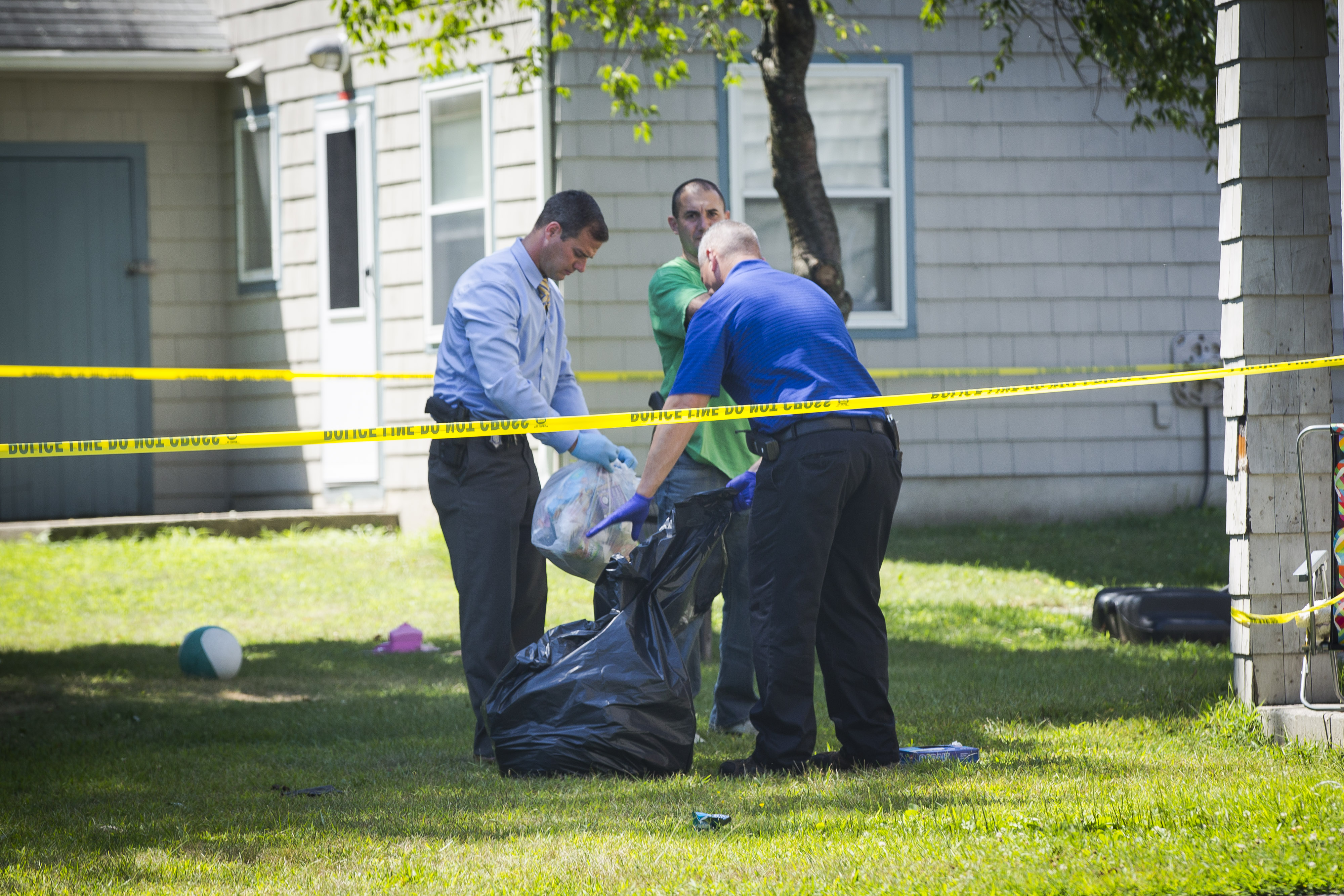 Officers searched for evidence at the Auburn home on Sunday.
