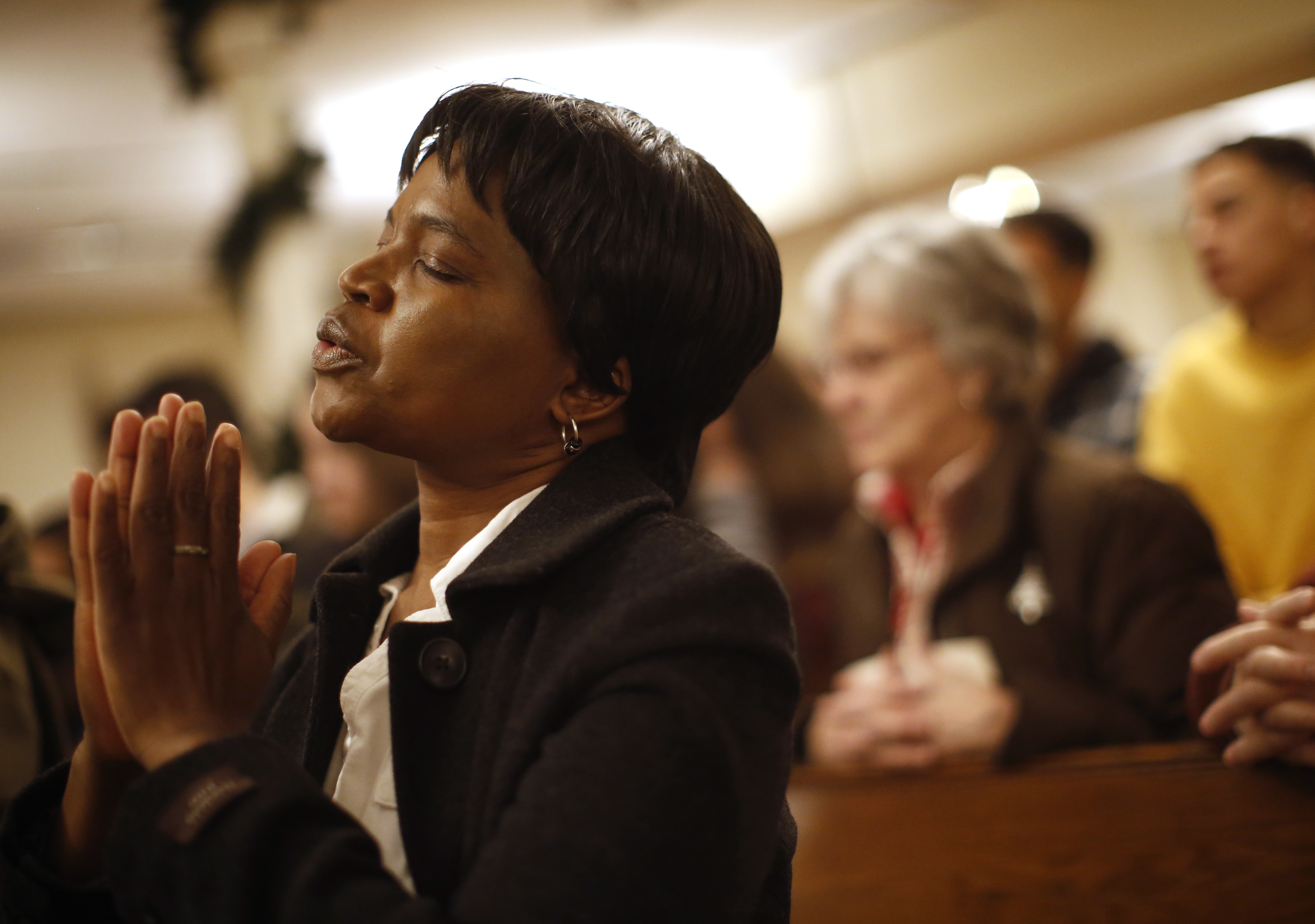 Elector Jackson, 54, prayed during Christmas Mass at the Cathedral of the Holy Cross in Boston.