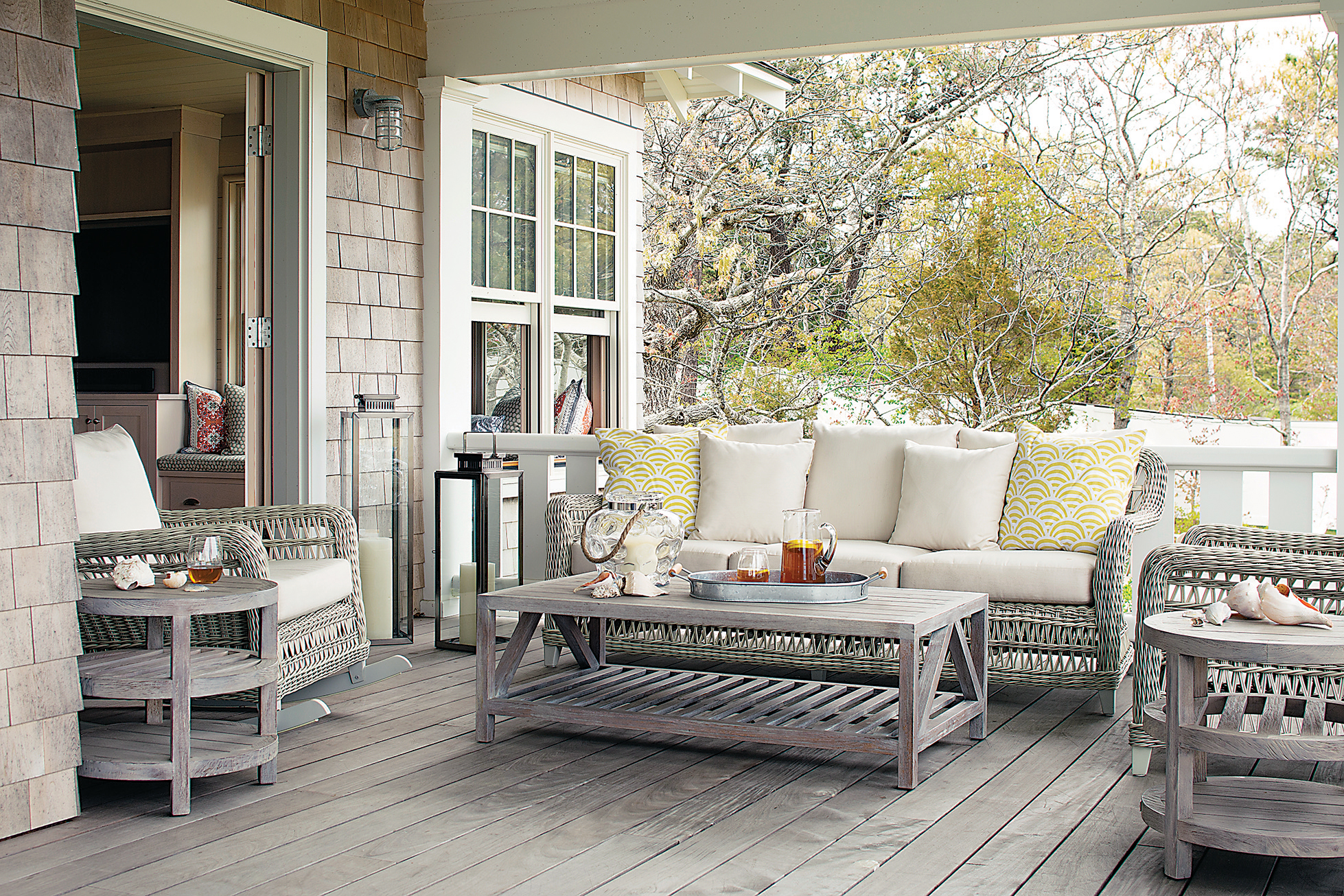 The seating and tables on the porch are from Janus et Cie.