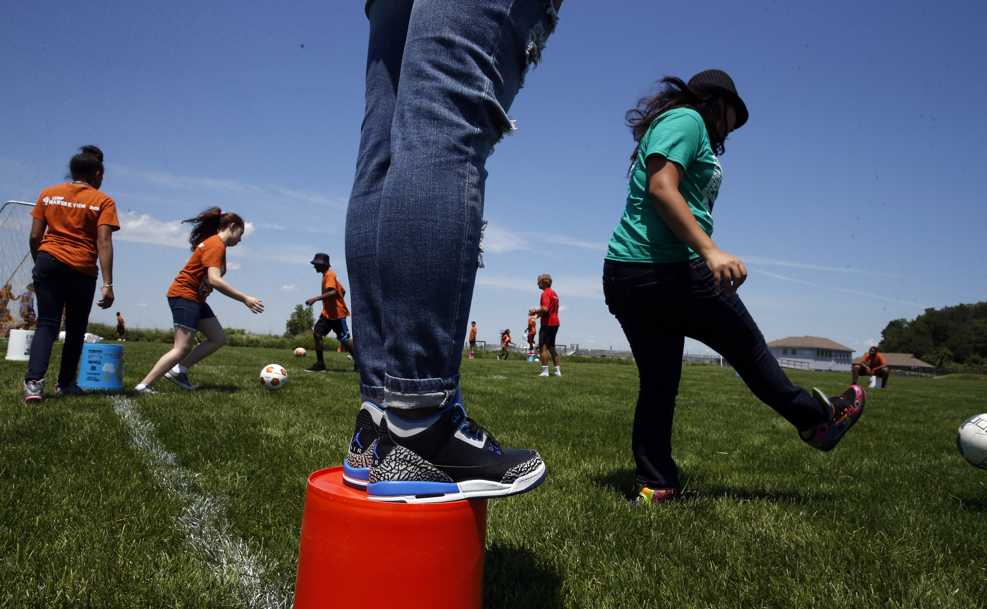 Camp Harbor View campers play a variation of a soccer game during their first trip to Long Island since the bridge was torn down.