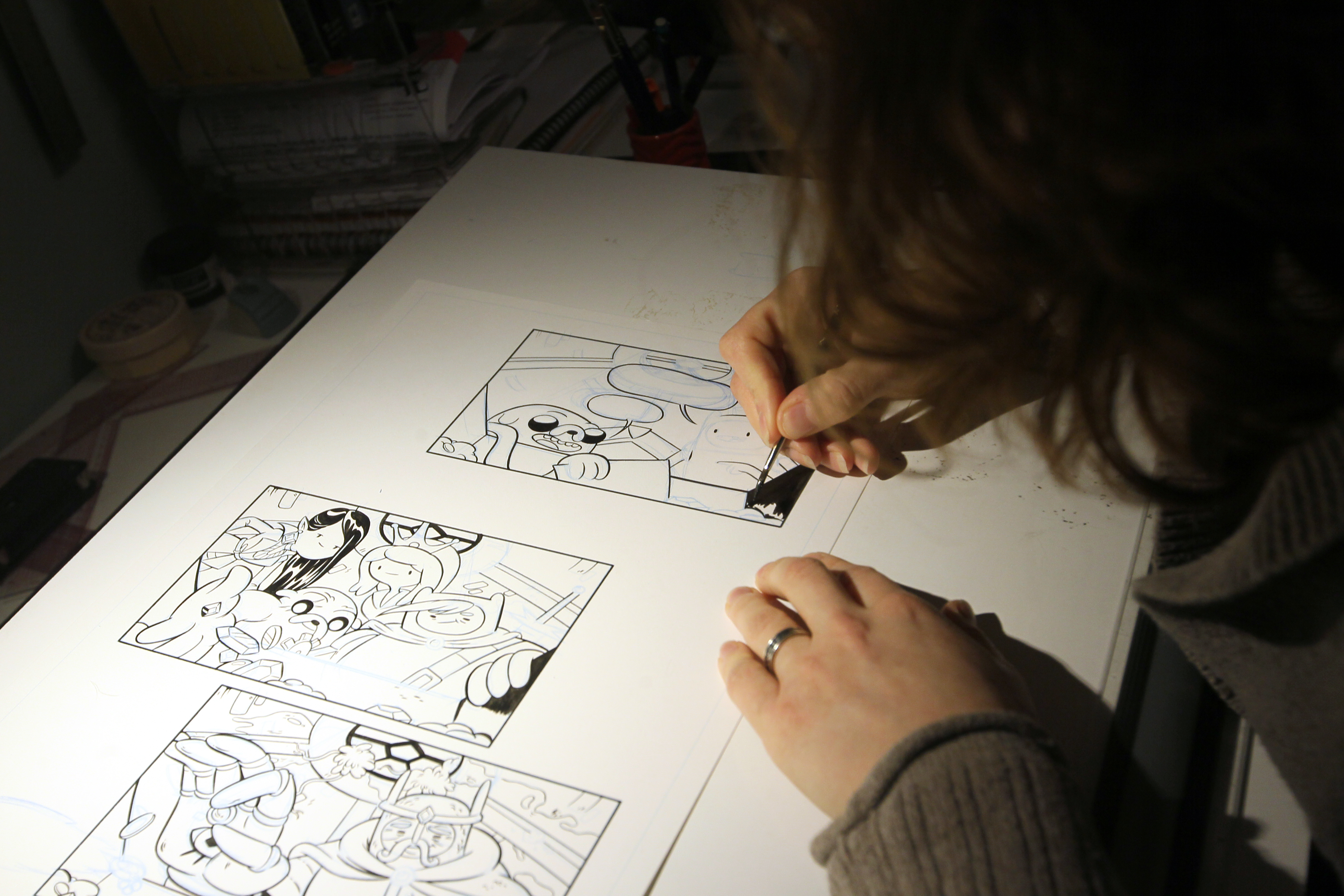 Shelli Paroline works on an issue of the comic.
