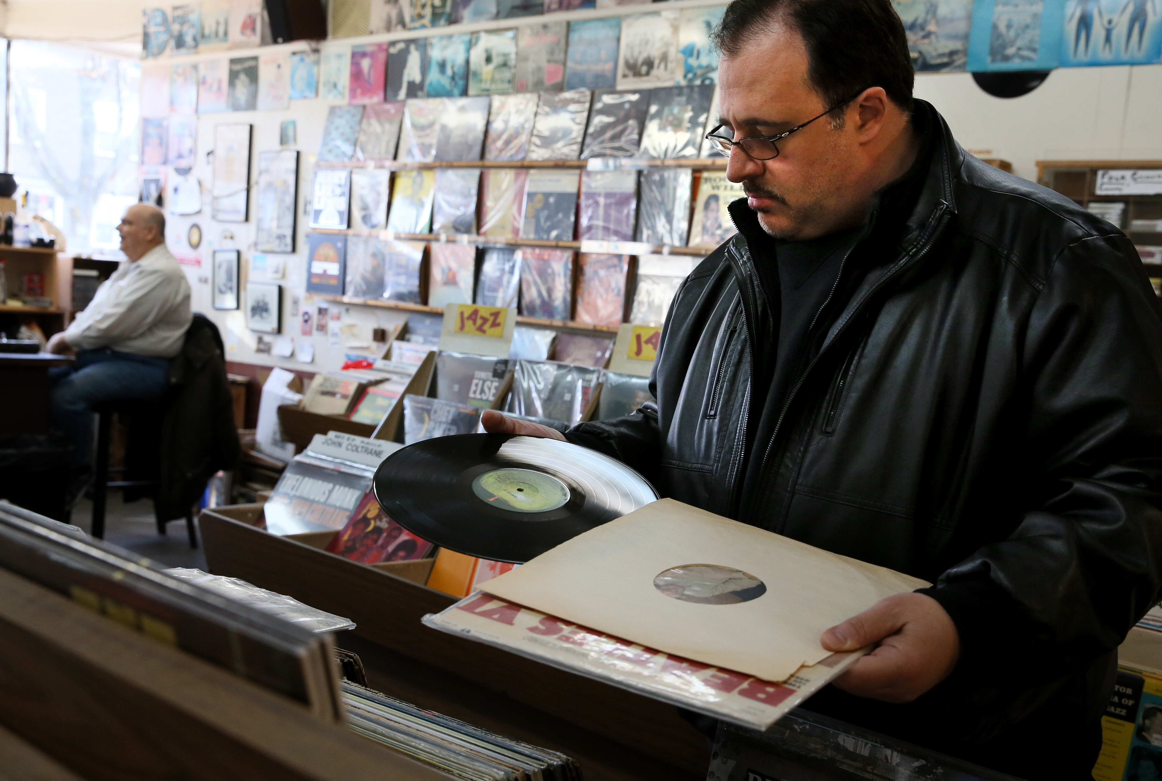 On the hunt for treasure, Gerald Fusco eyed the shelf of LPs for sale inside Stereo Jack’s Records in Cambridge Saturday.