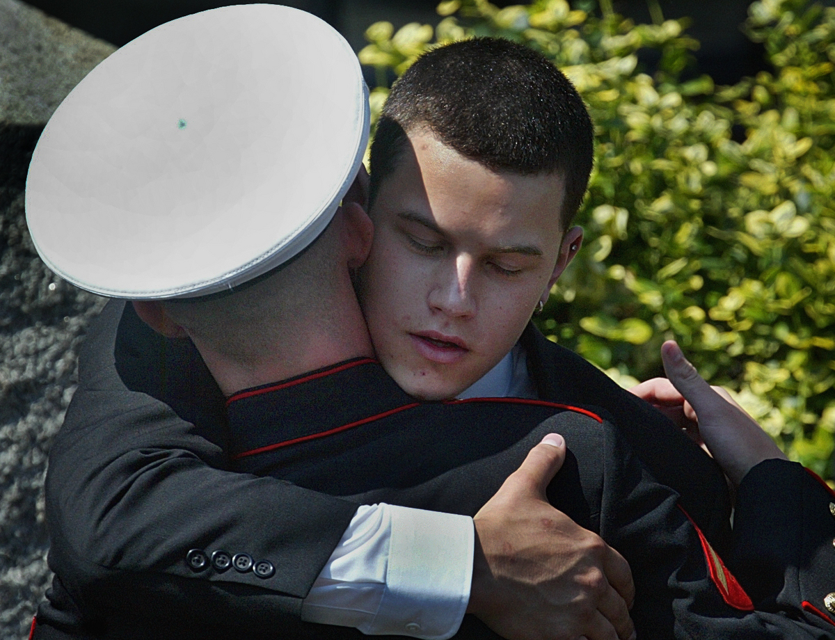 Brian greeted a Marine following funeral services for his older brother Alex, who died in Iraq, in September 2004.