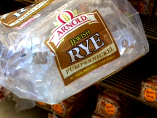 A photo from the city shows bread with holes caused by mice in a storage area of the grocery store.