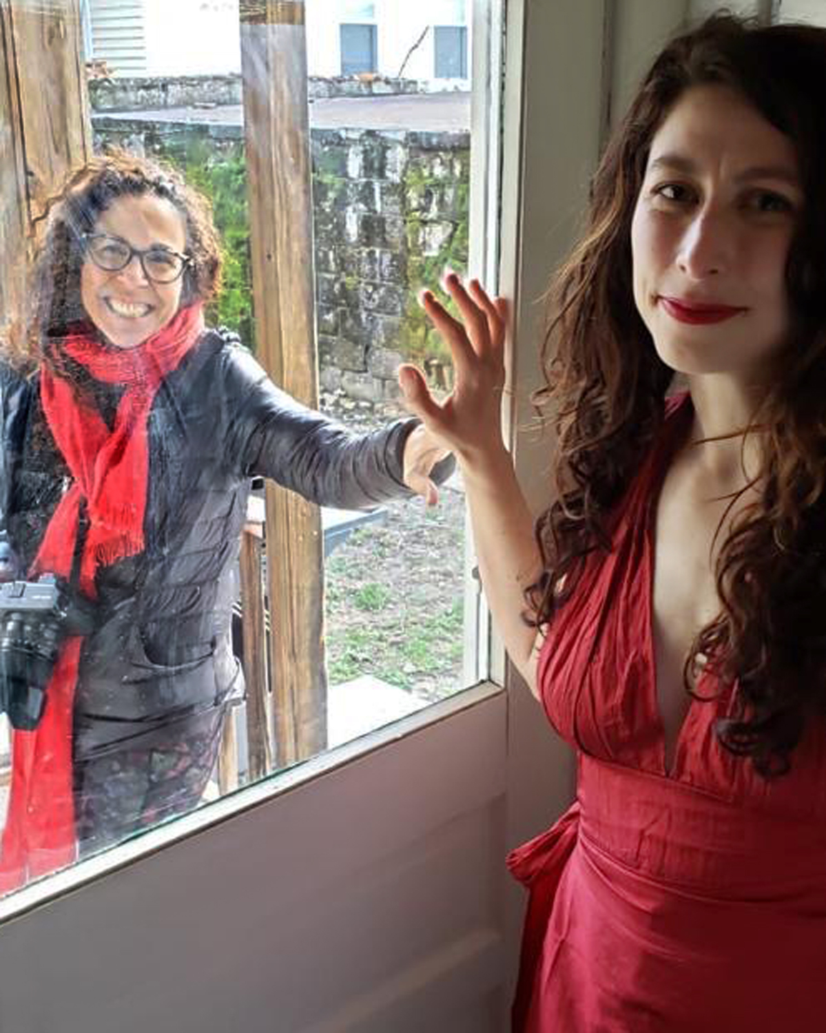 Rania Matar (left) arrived in Allston to photograph Mia Dalglish and her husband.