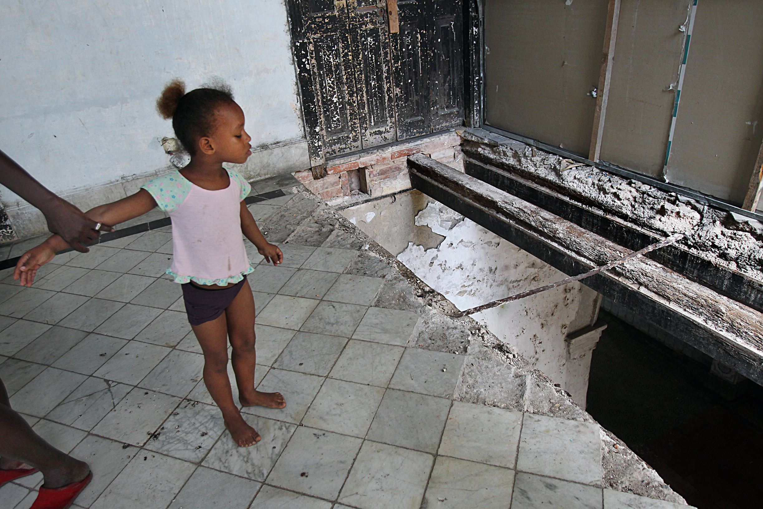 Erianni Diaz, 4, and her grandmother, Maria Garcia, live in a condemned hotel.