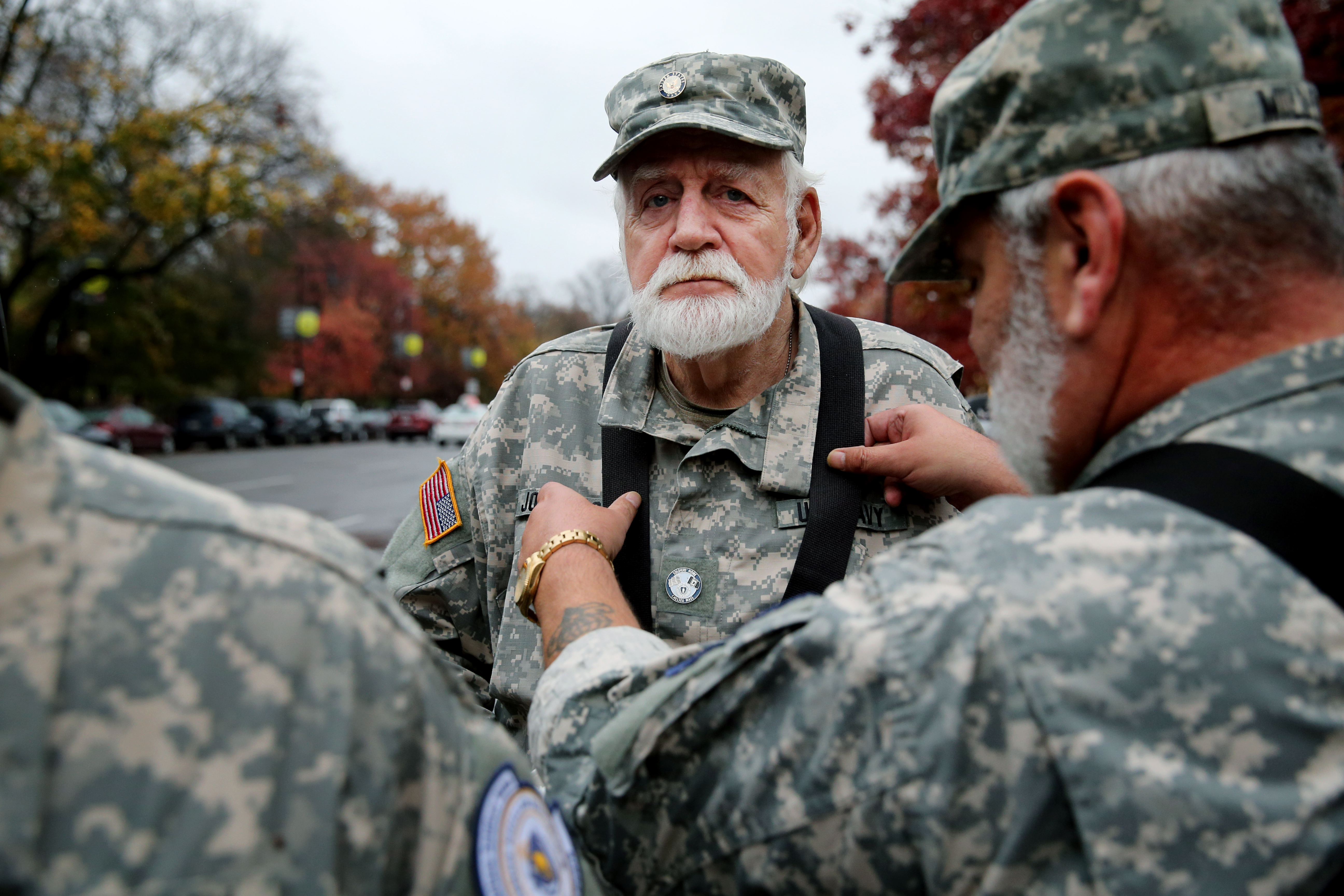 Richard Johnsson (left) and Tom Miller, members of the Chelsea Soldiers’ Home, prepared to march in the Boston parade.
