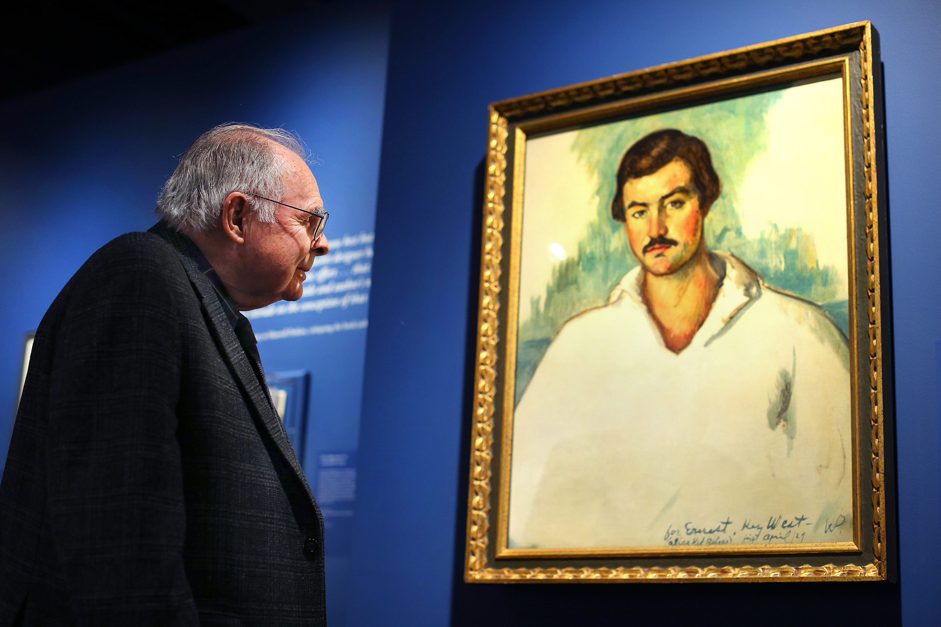 Patrick Hemingway paused to admire a portrait painted of his father by artist Waldo Pierce in 1929.