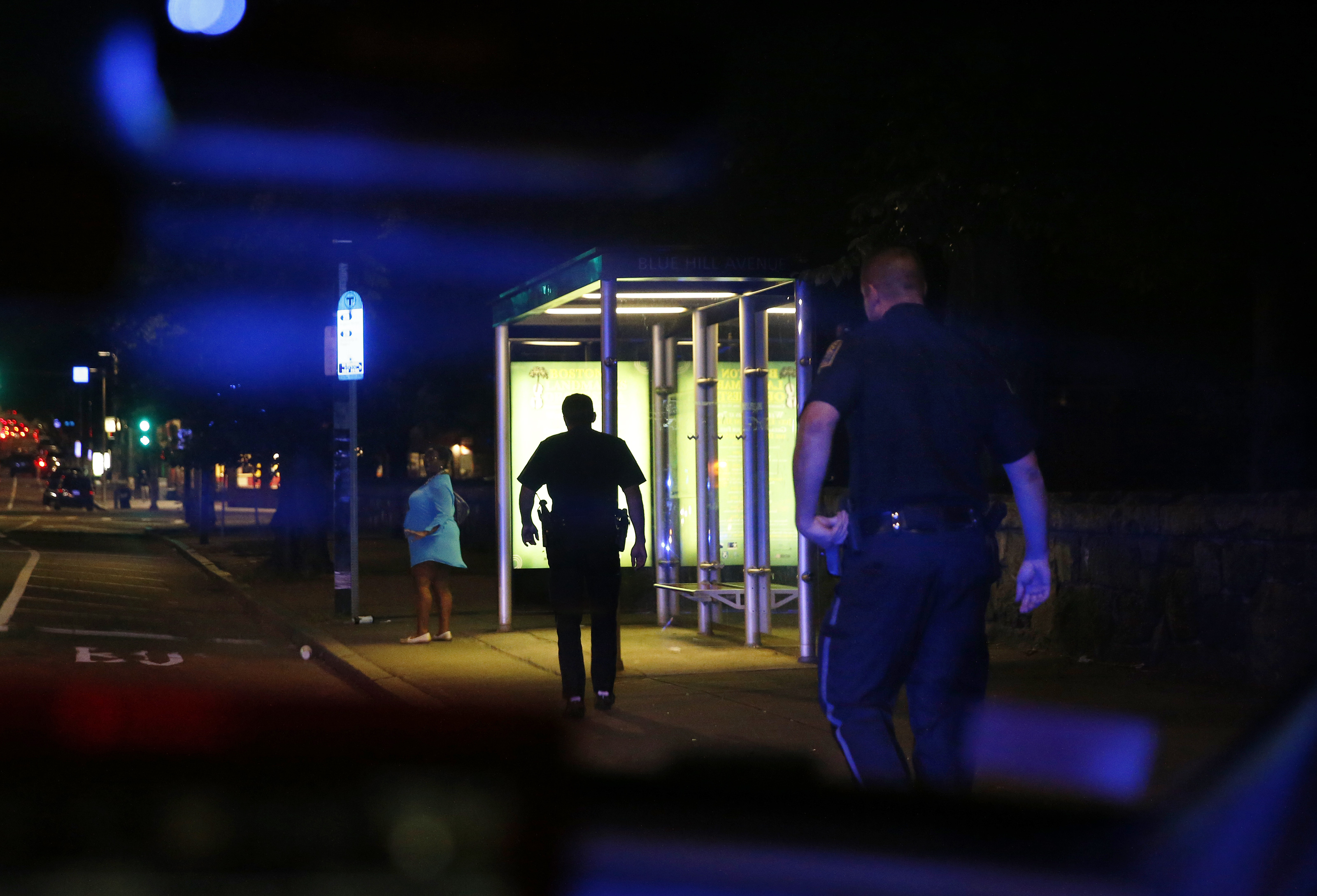 Driscoll (center) and Sullivan approached a woman who jumped out of a vehicle in the middle of Blue Hill Avenue.