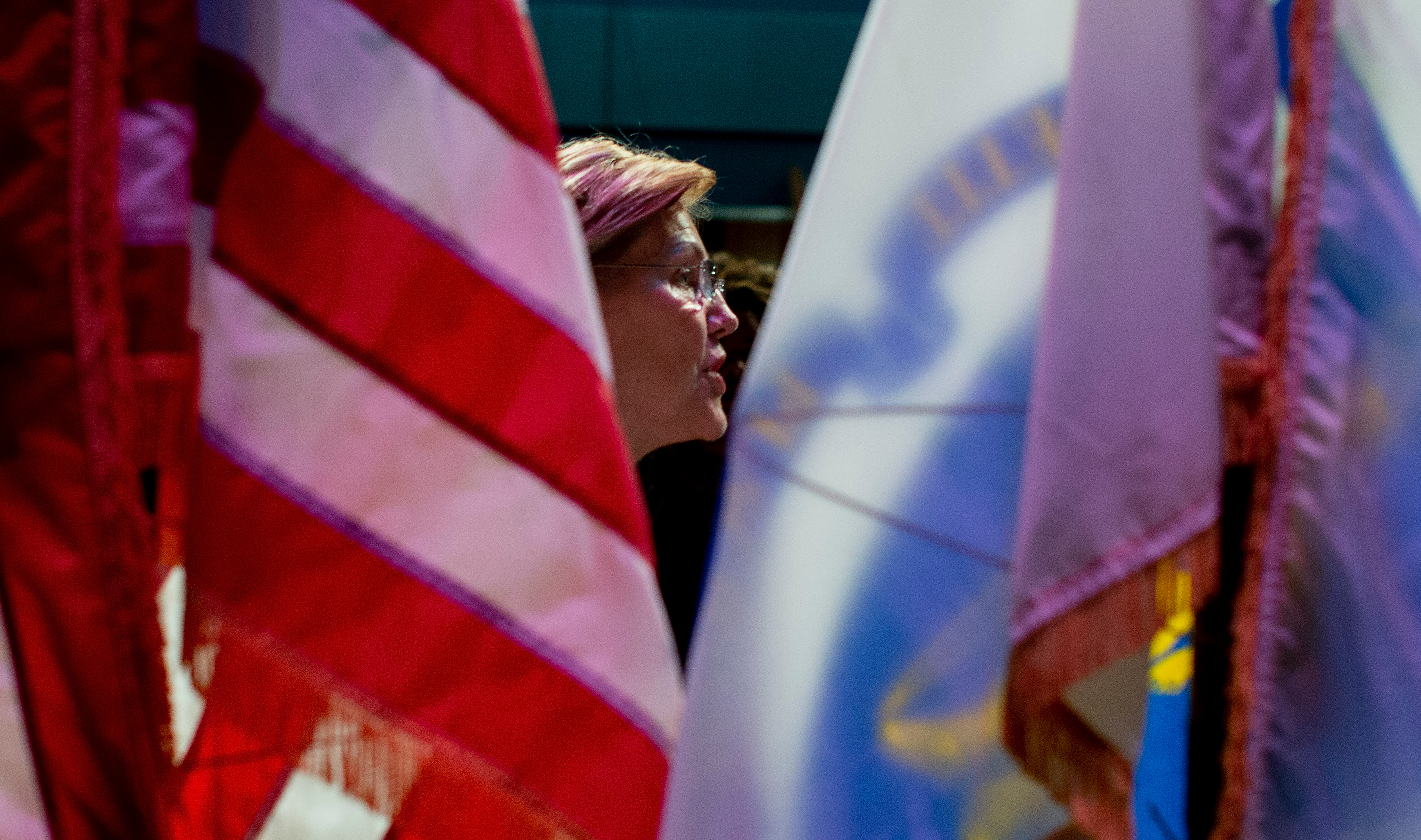 Warren spoke with a supporter following the Woburn gathering.