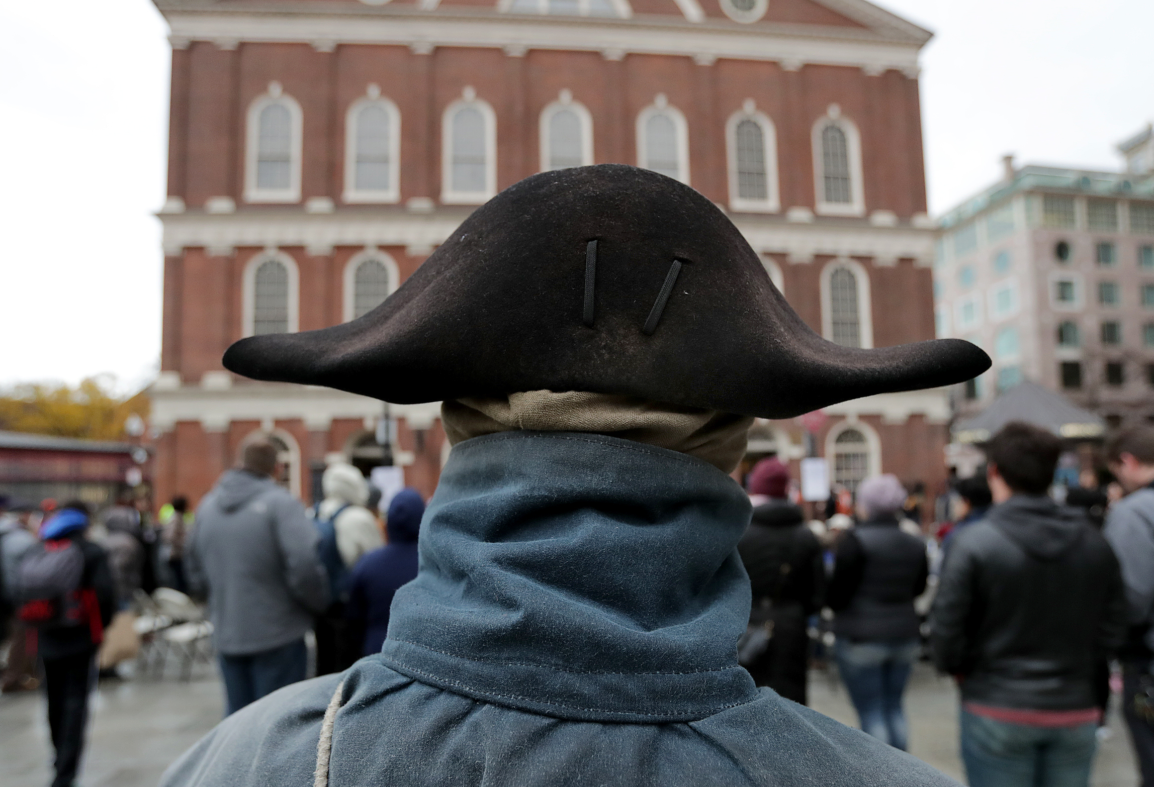 People watched the rally outside Faneuil Hall.