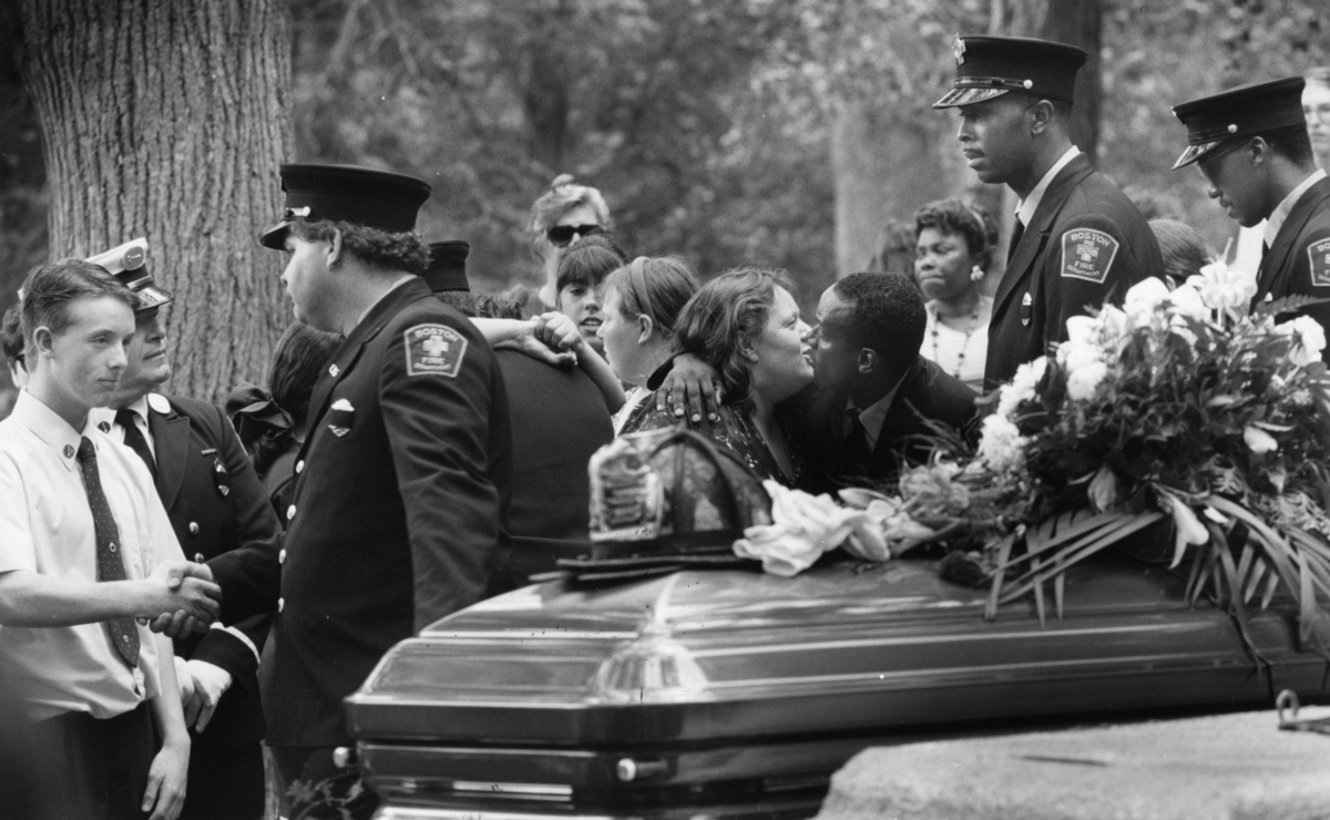 Joseph wore his father’s uniform shirt during the funeral service at the Cedar Grove Cemetery in Dorchester.
