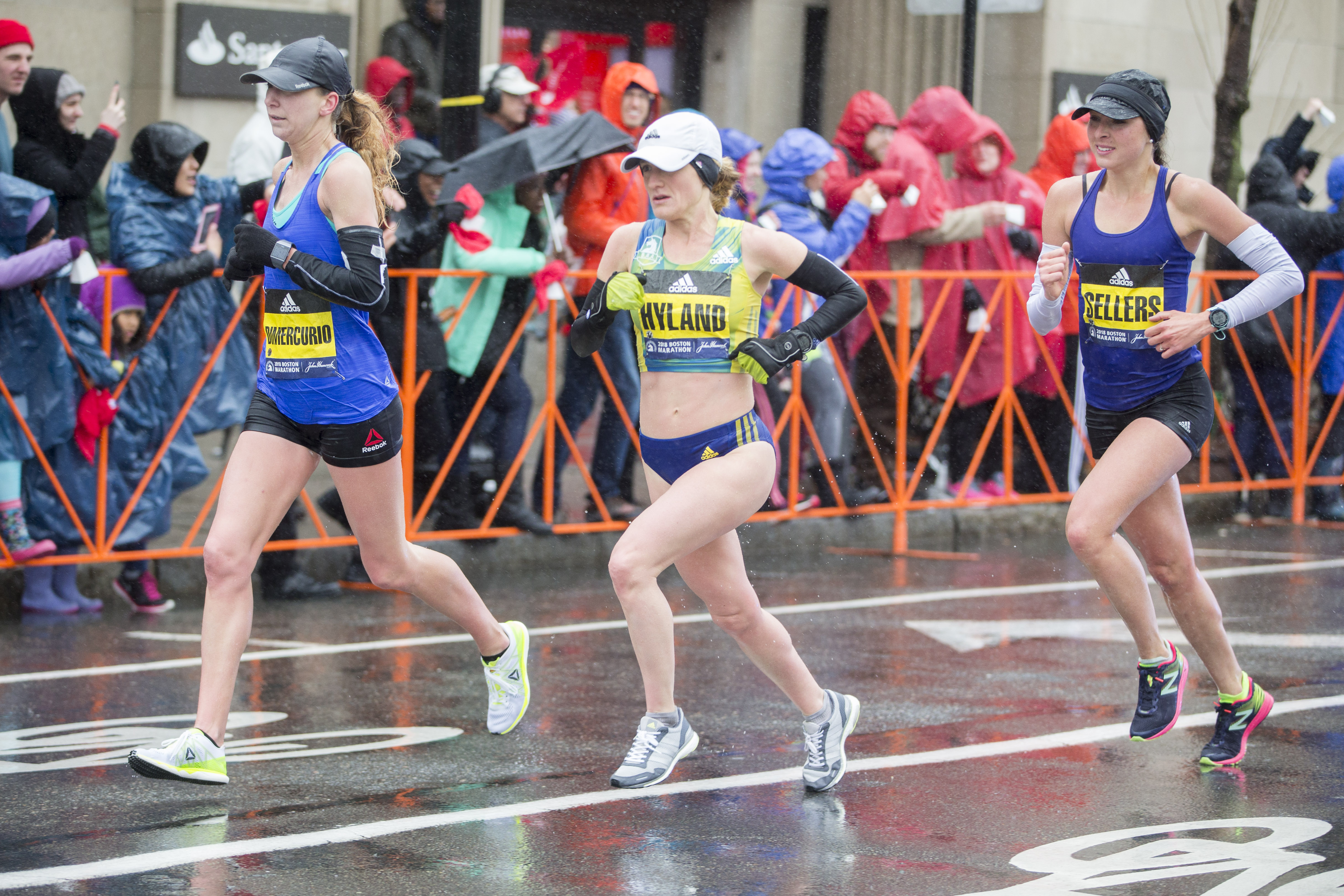 Sarah Sellers (far right) during the Boston Marathon in Brookline. Also pictured are, from left, Nicole Dimercurio and Rachel Hyland.