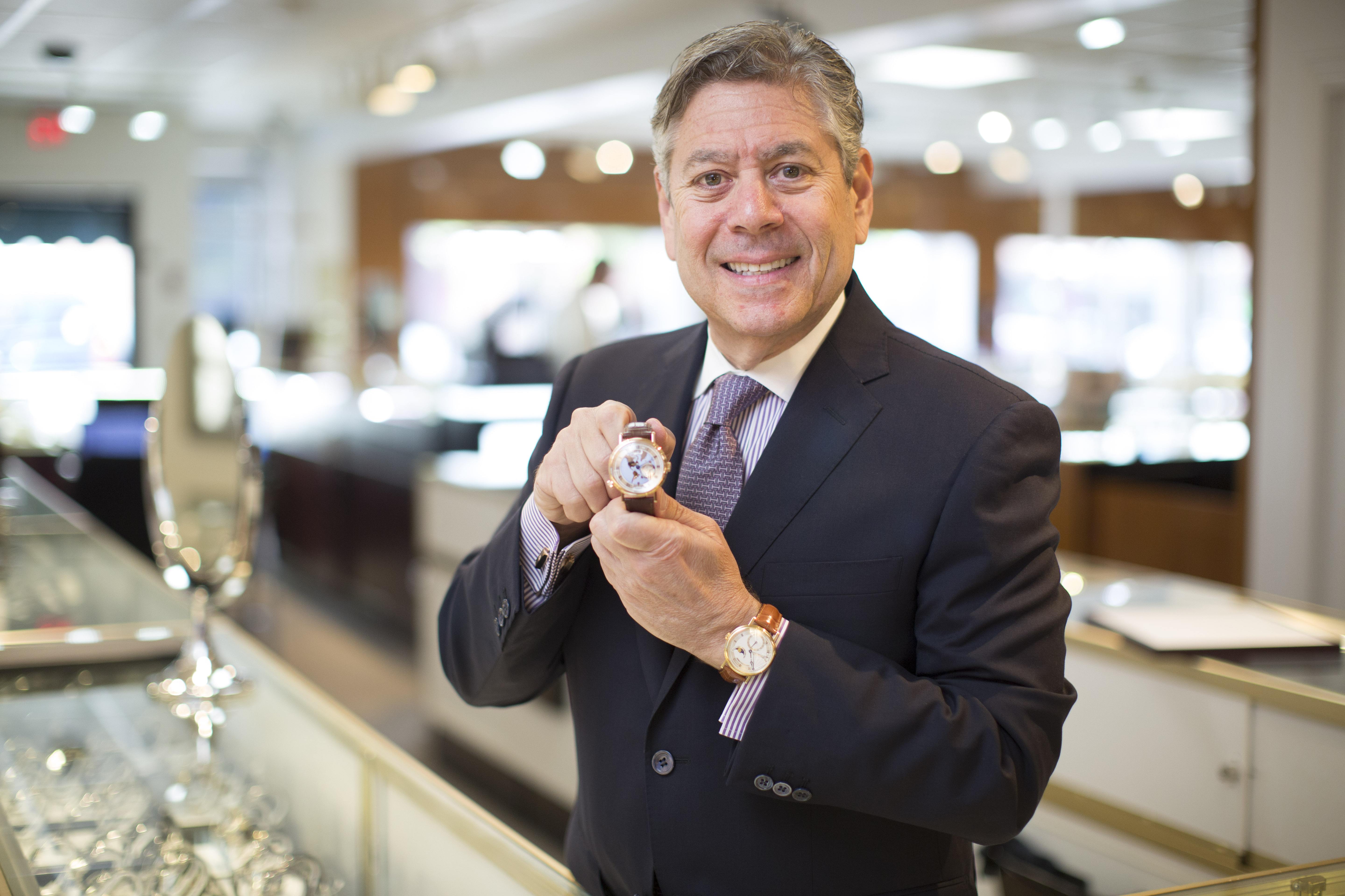 Steven B. Leed, president of Royal Jewelers in Andover, holds a Breguet Hora Mundi.