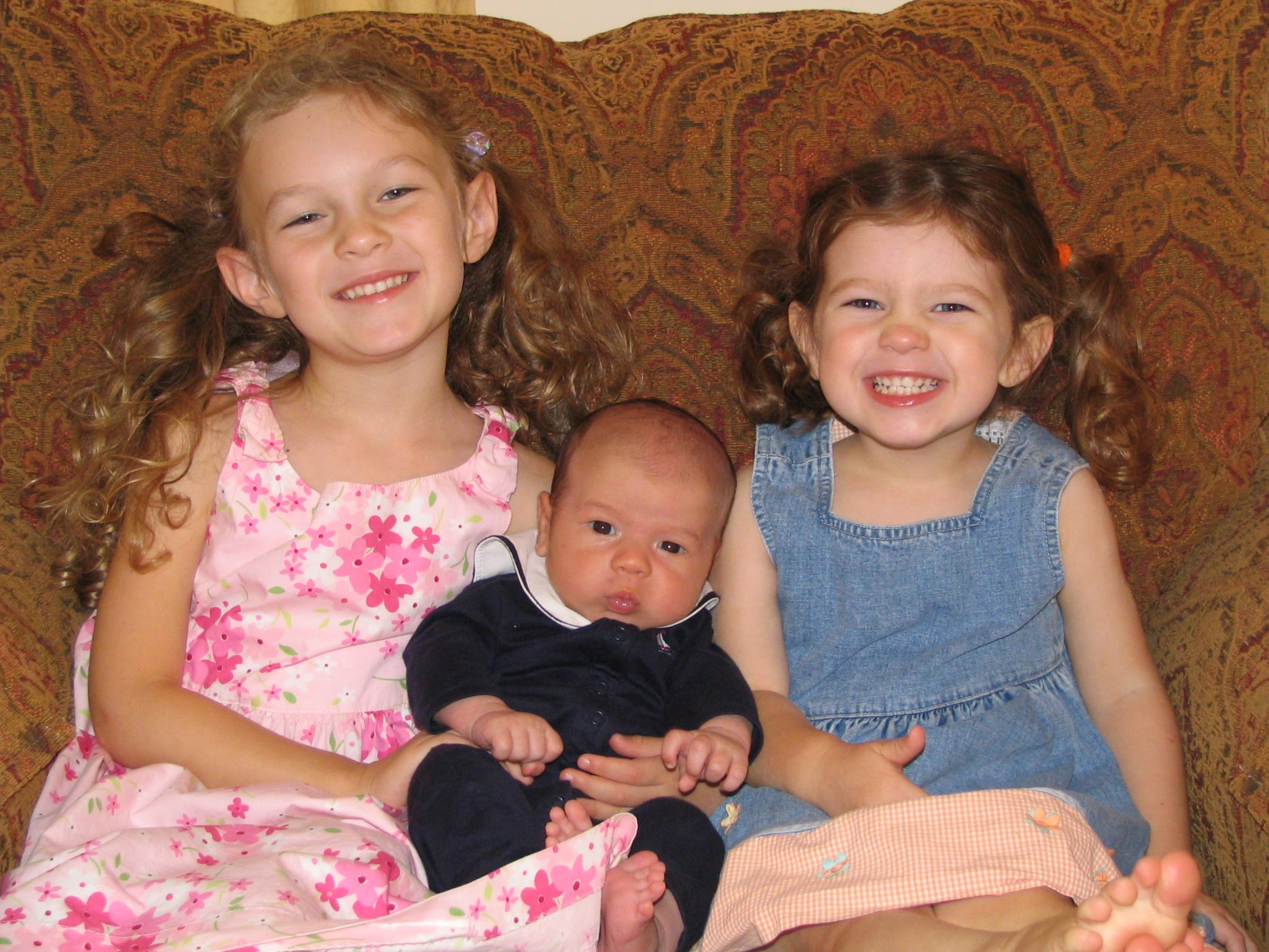 Alexandra (left) with her infant brother, Nicholas, and sister Emily.