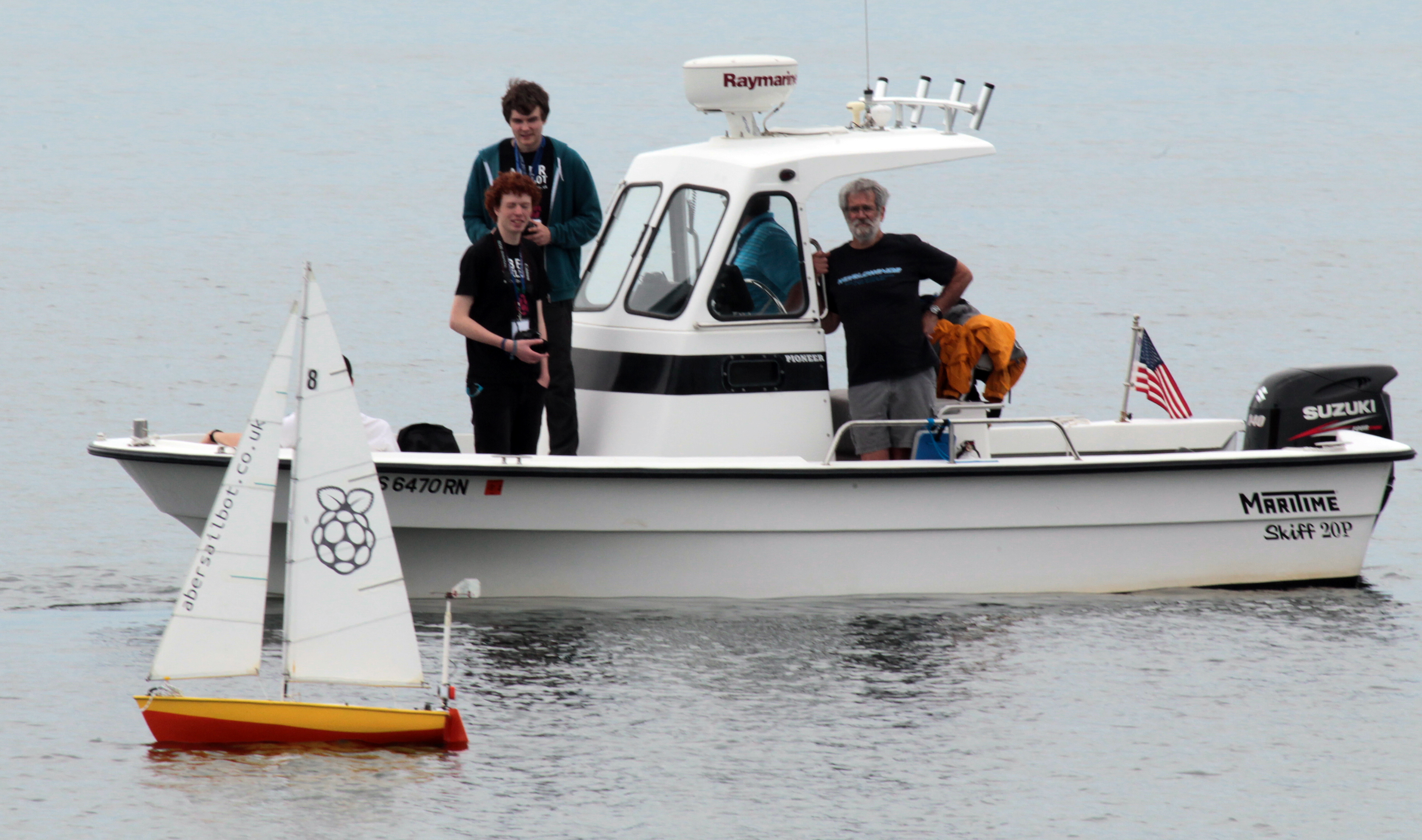 Members of the team from Aberystwth, Wales, keep an eye on their boat <span channel="!BostonGlobe/W2_REG-01">and the competition<span channel="!BostonGlobe/NO2_REG-01,!BostonGlobe/NO1_REG-01"/>
</span>
<span channel="!BostonGlobe/NO2_REG-01,!BostonGlobe/NO1_REG-01"> in Gloucester Harbor</span>.