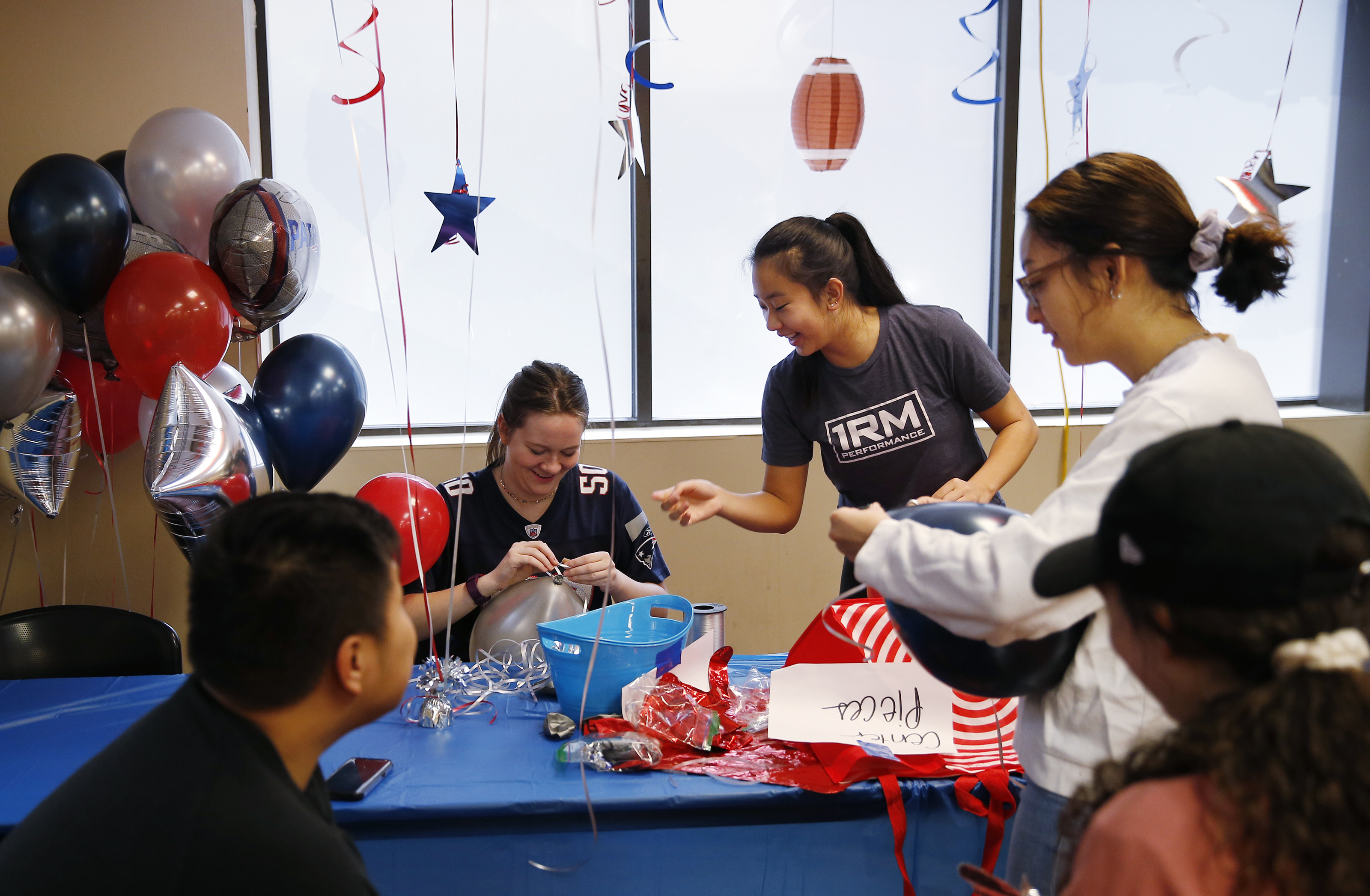 Volunteers from Northeastern University including Heather Guglietti, seated, and Sydny Poh helped with the preparations.