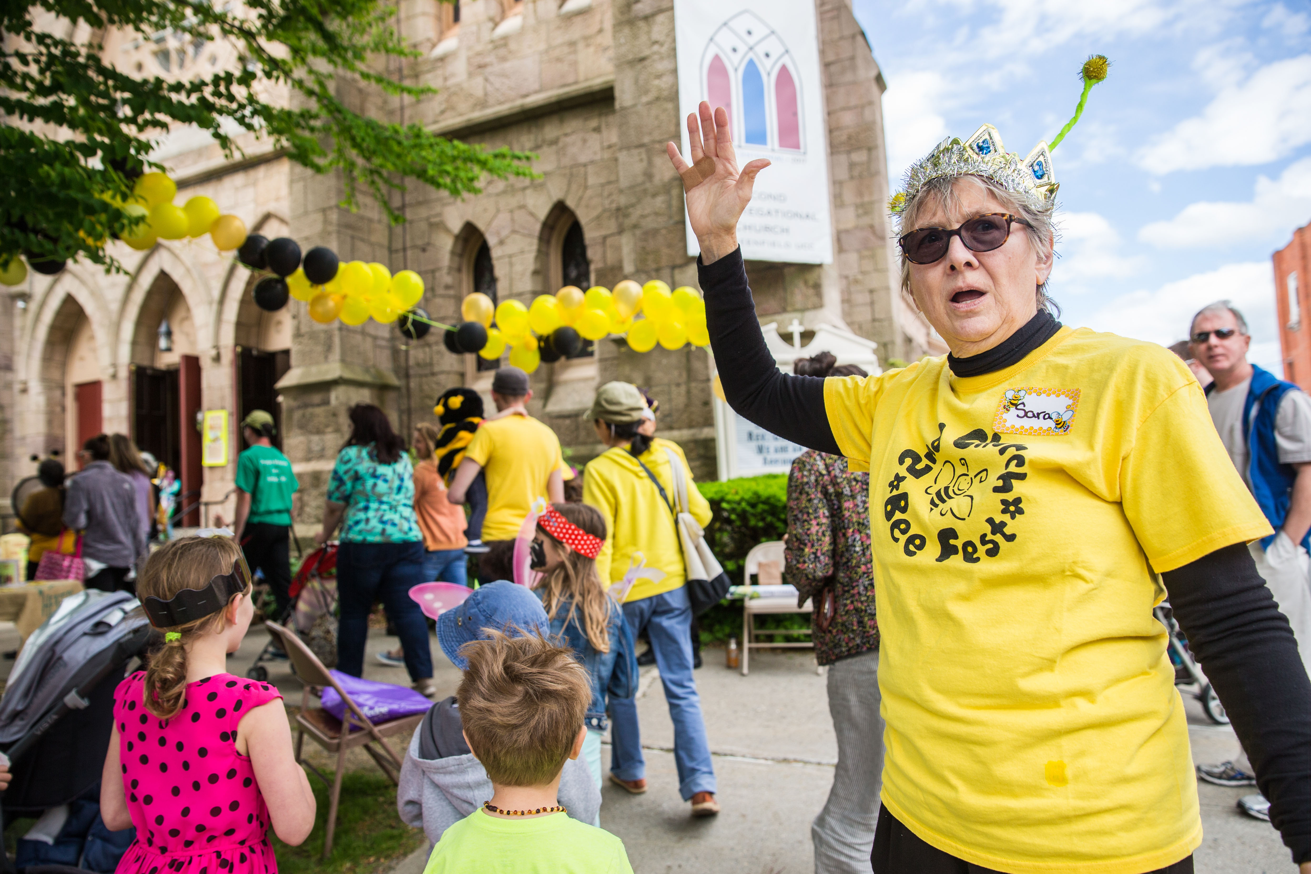 Volunteer Sara Penn-Strah greeted visitors during the Langstroth Bee Fest on Saturday.