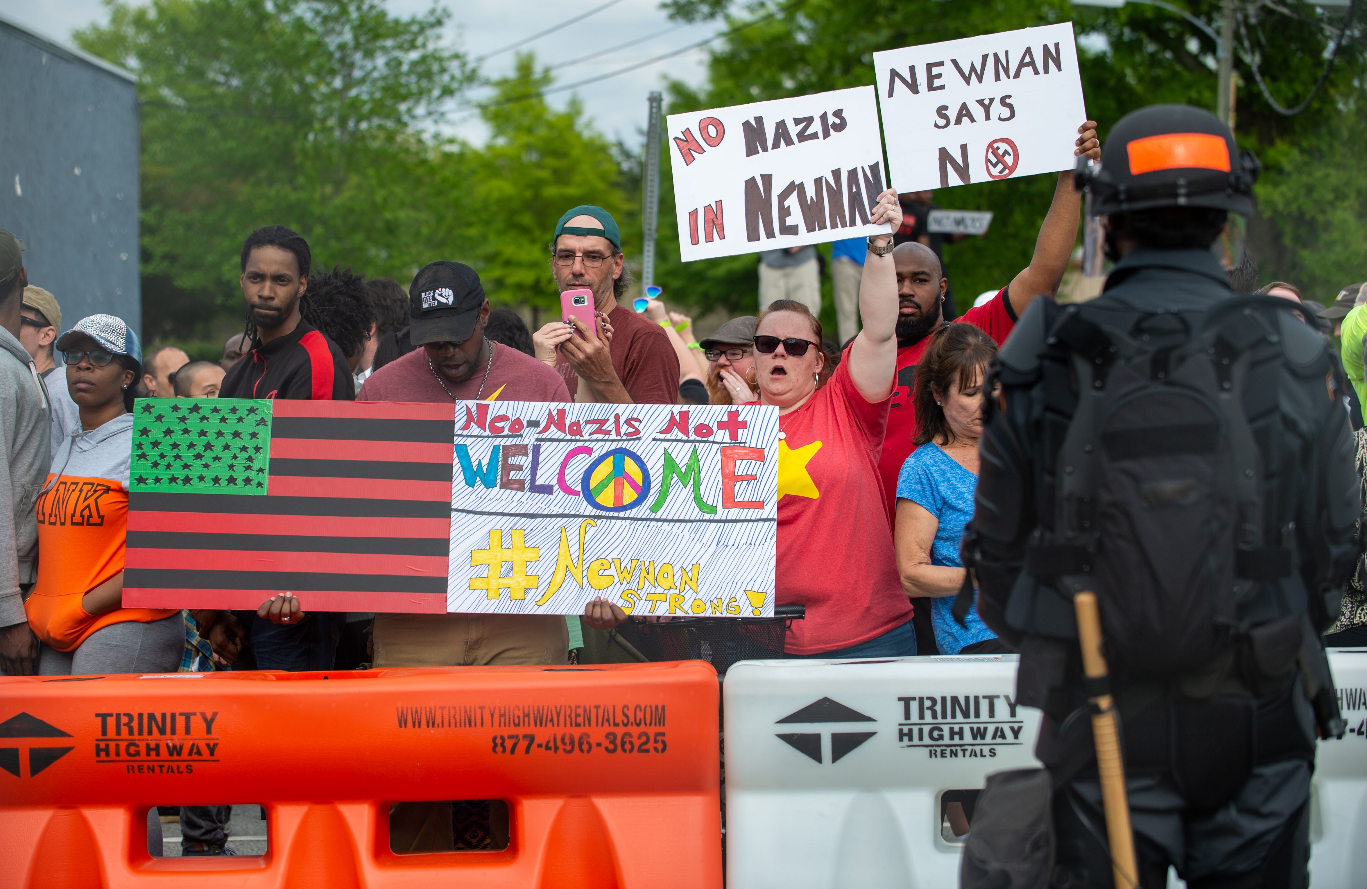 Counterprotesters chant in opposition to the neo-Nazis Saturday in Newnan.