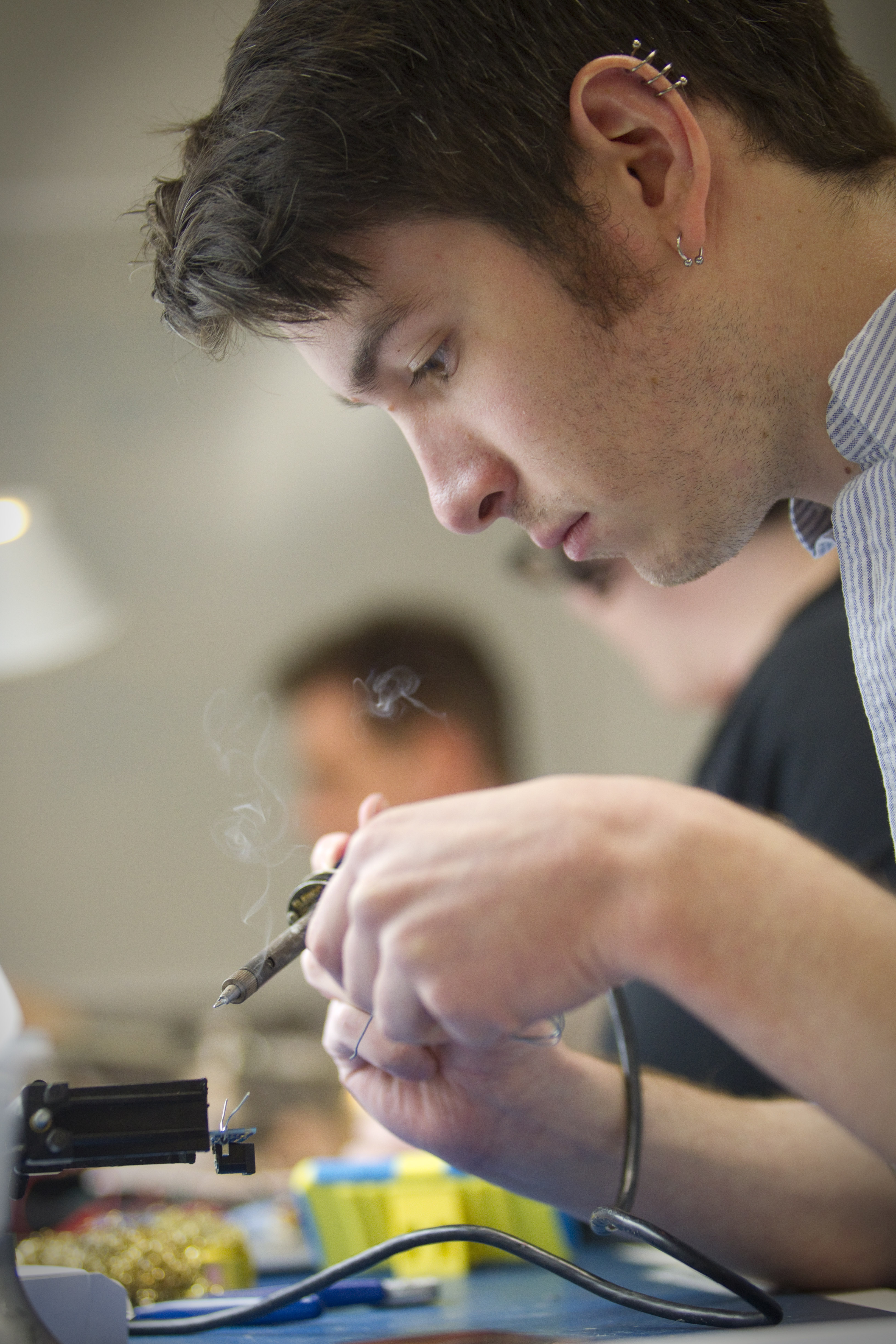 Michael Murray works on a power supply for a breadboard during Circuit Hacking Night at Artisan’s Asylum.