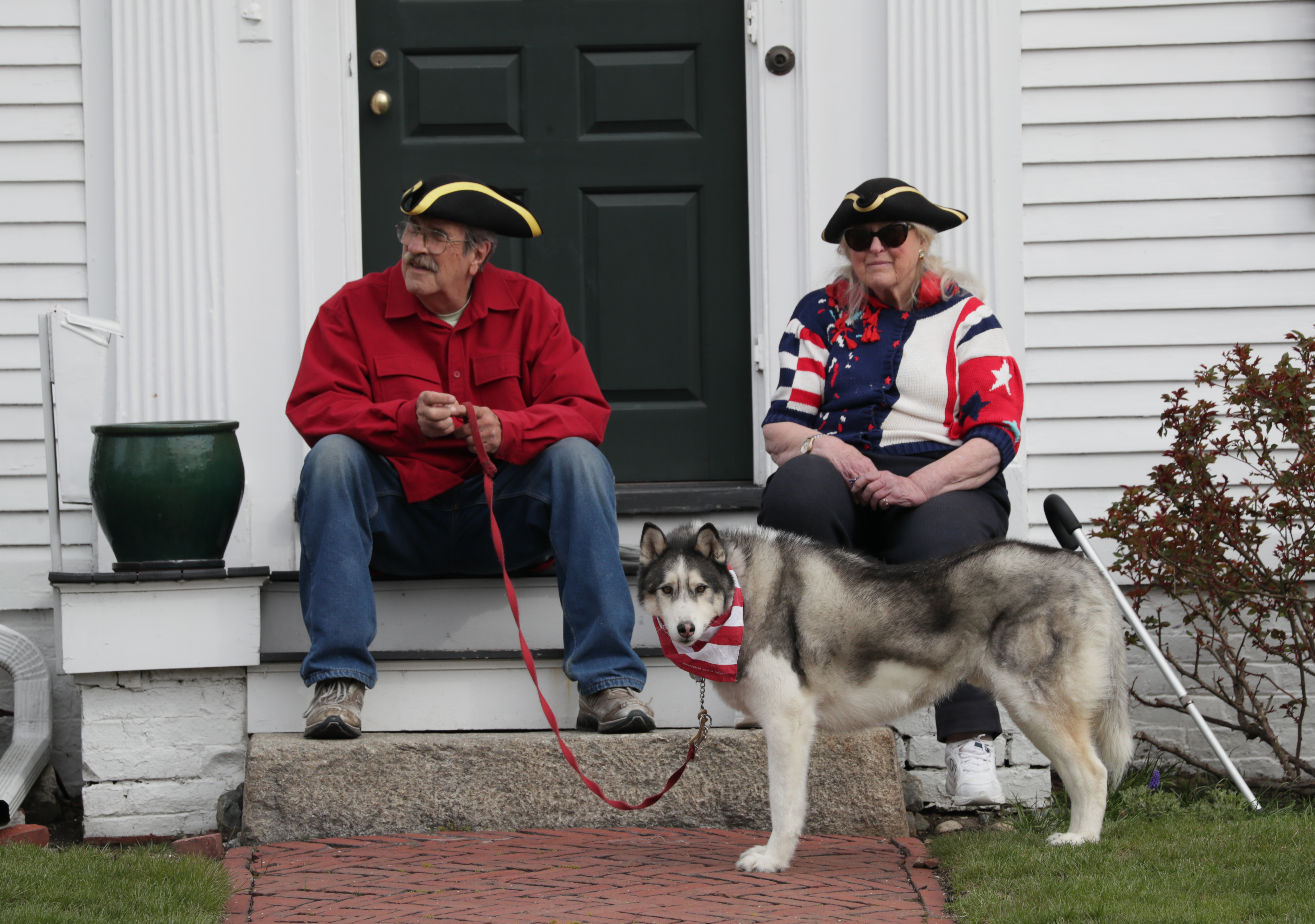 Joann Gschwendtner with her dog Nikki and friend Peter Chalpin watched as Lexington Minutemen commemorated the Battle of Lexington.