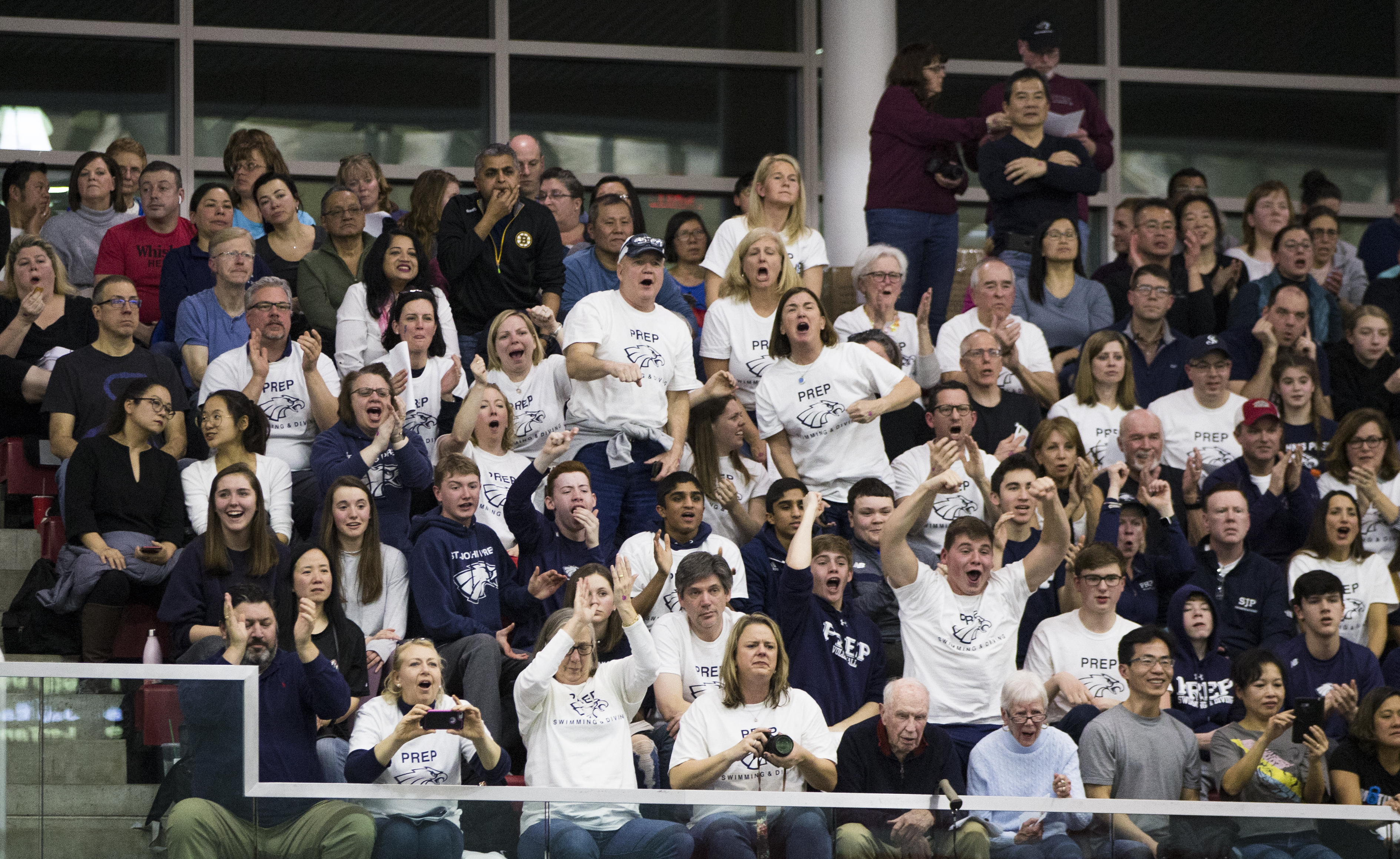 Supporters of the St. John's Prep made certain they were loud and proud in bringing the energy to their swim team on Sunday night at Boston University.