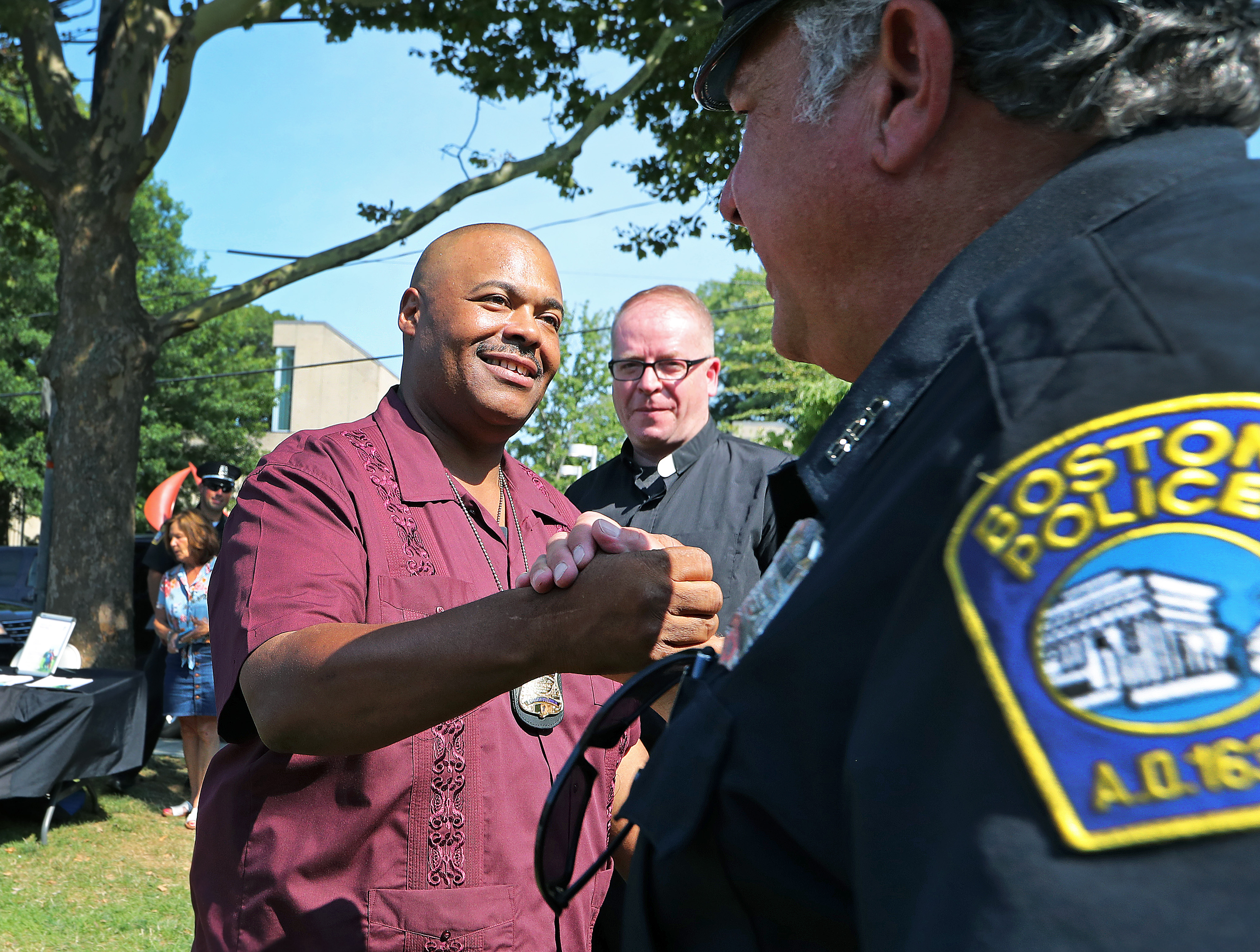 Later in the day, Gross visited National Night Out events held across the city. Above, Gross was greeted at a stop in Brighton by Officer Jerry Ajemian.