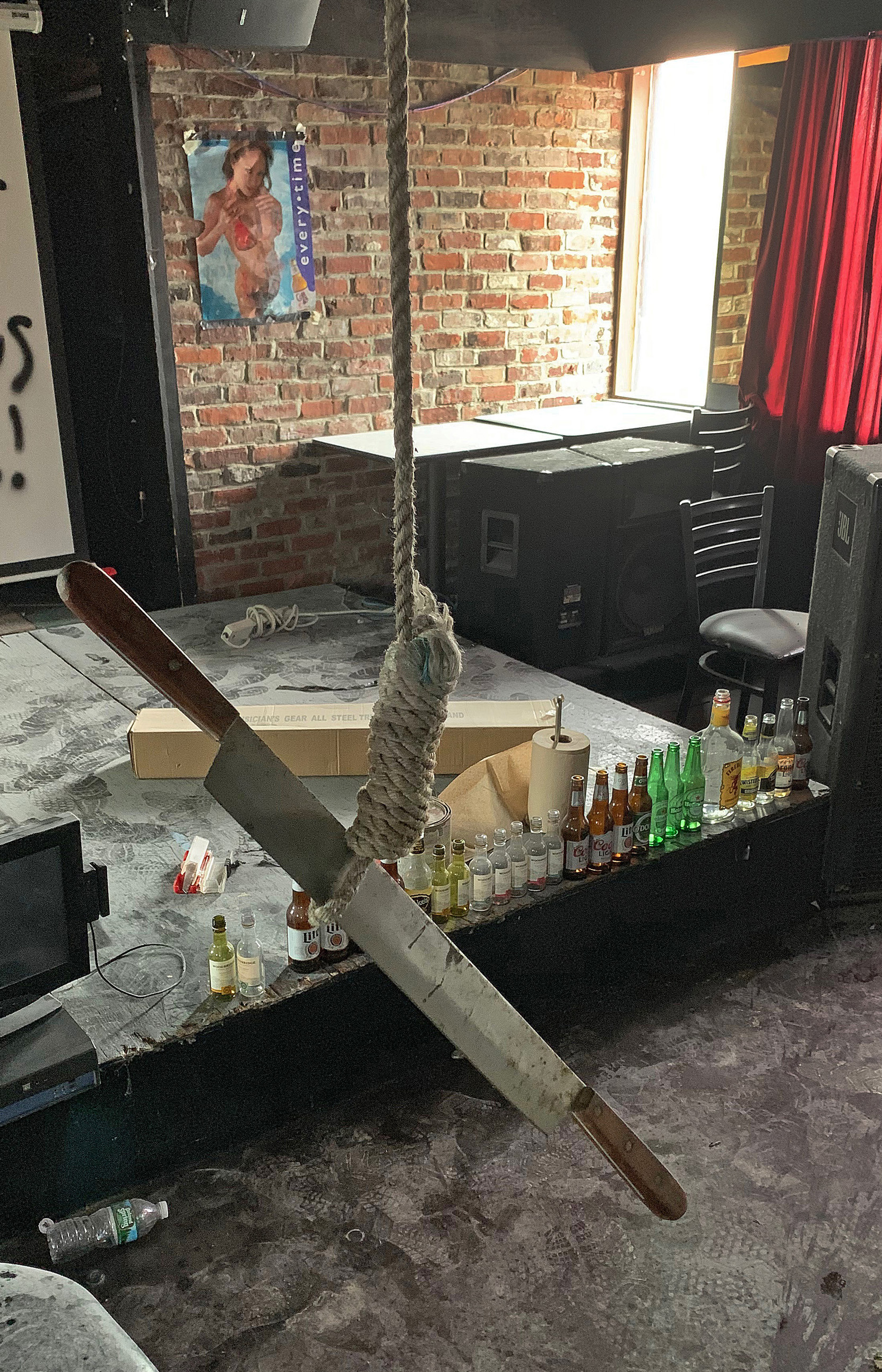 A knife was found hanging from a rope.