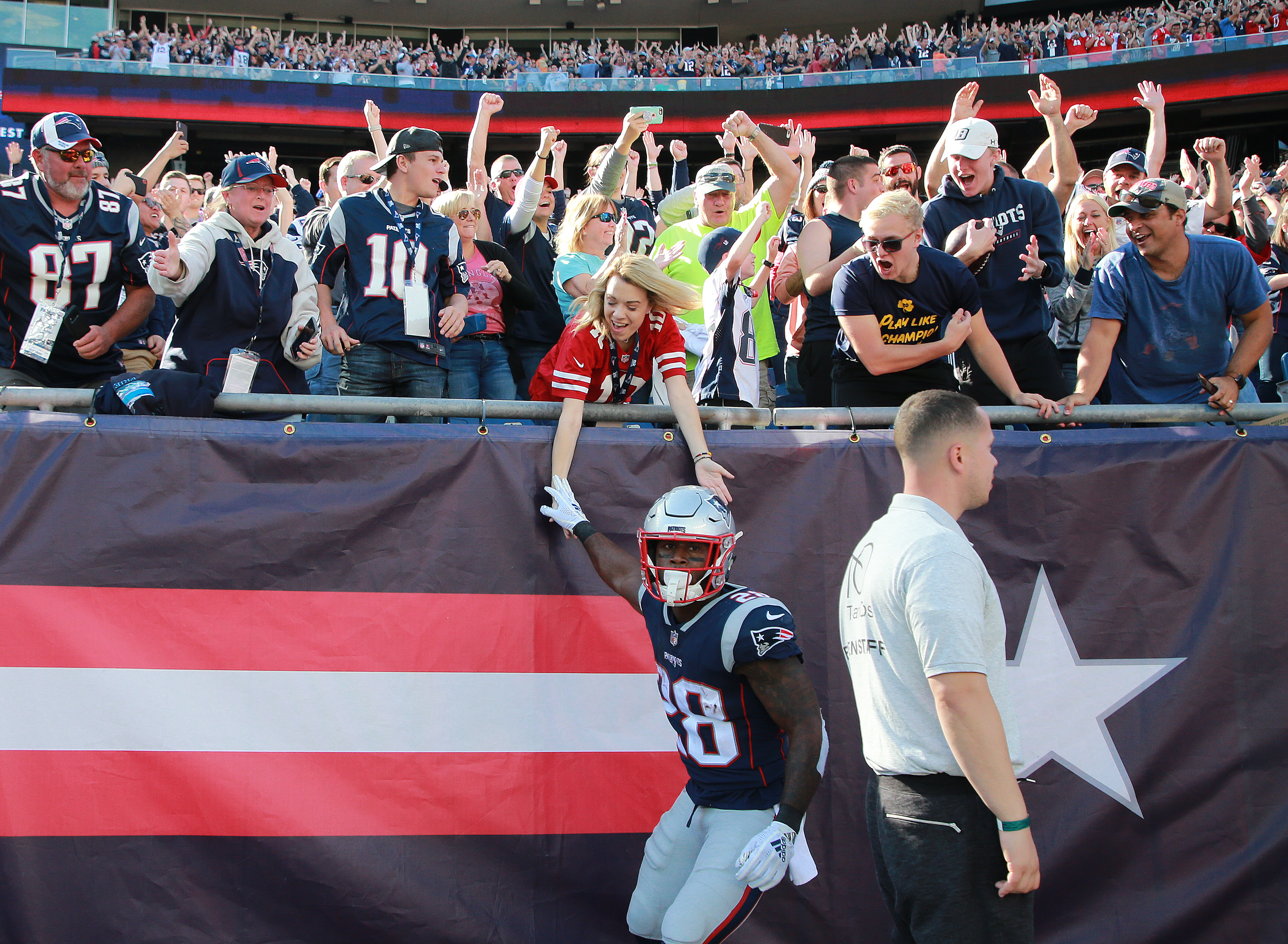 James White celebrated with fan after his touchdown reception in the third quarter.
