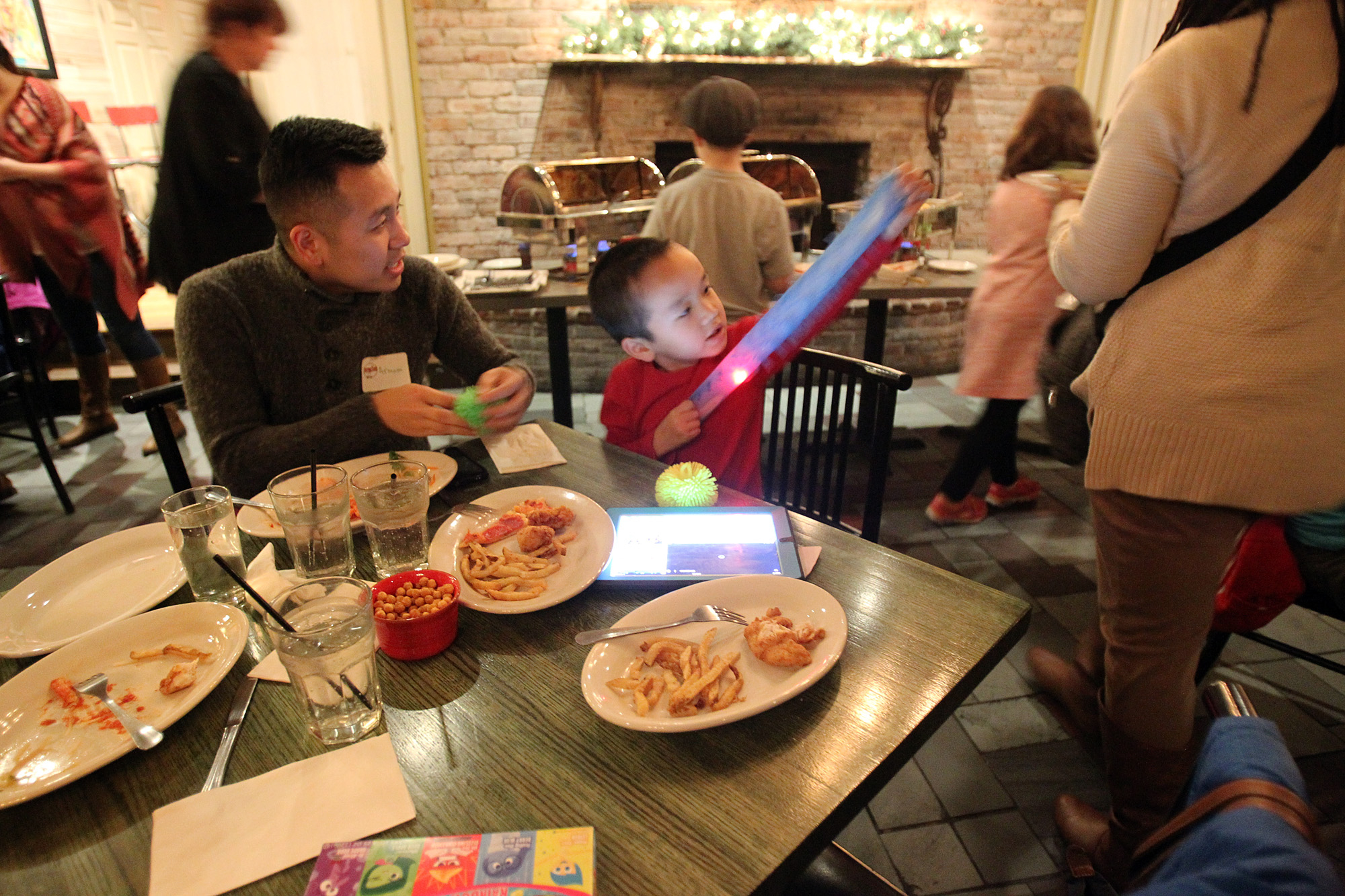Landon Sorth played with a toy as he shared a meal with his uncle Armani Thao.