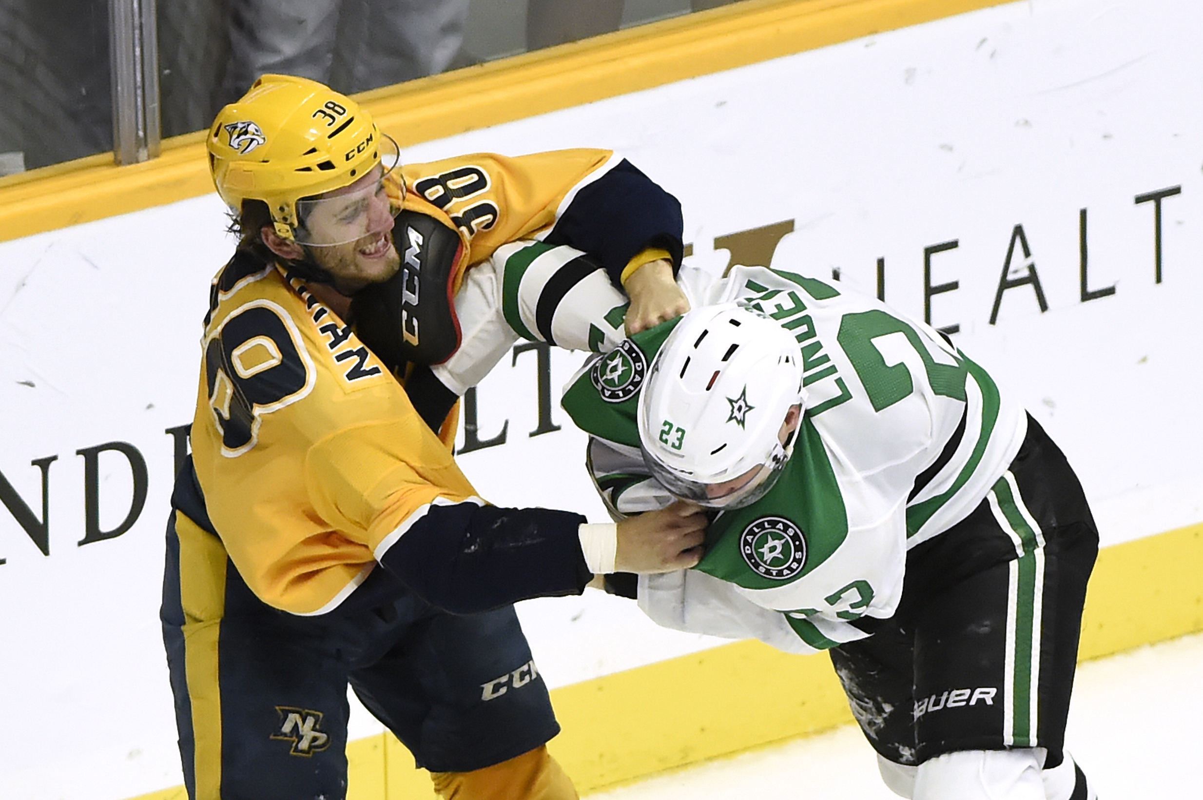 Fights, like this one between the Predators’ Ryan Hartman, left, and the Stars’ Esa Lindell, are at a premium in the NHL this year.