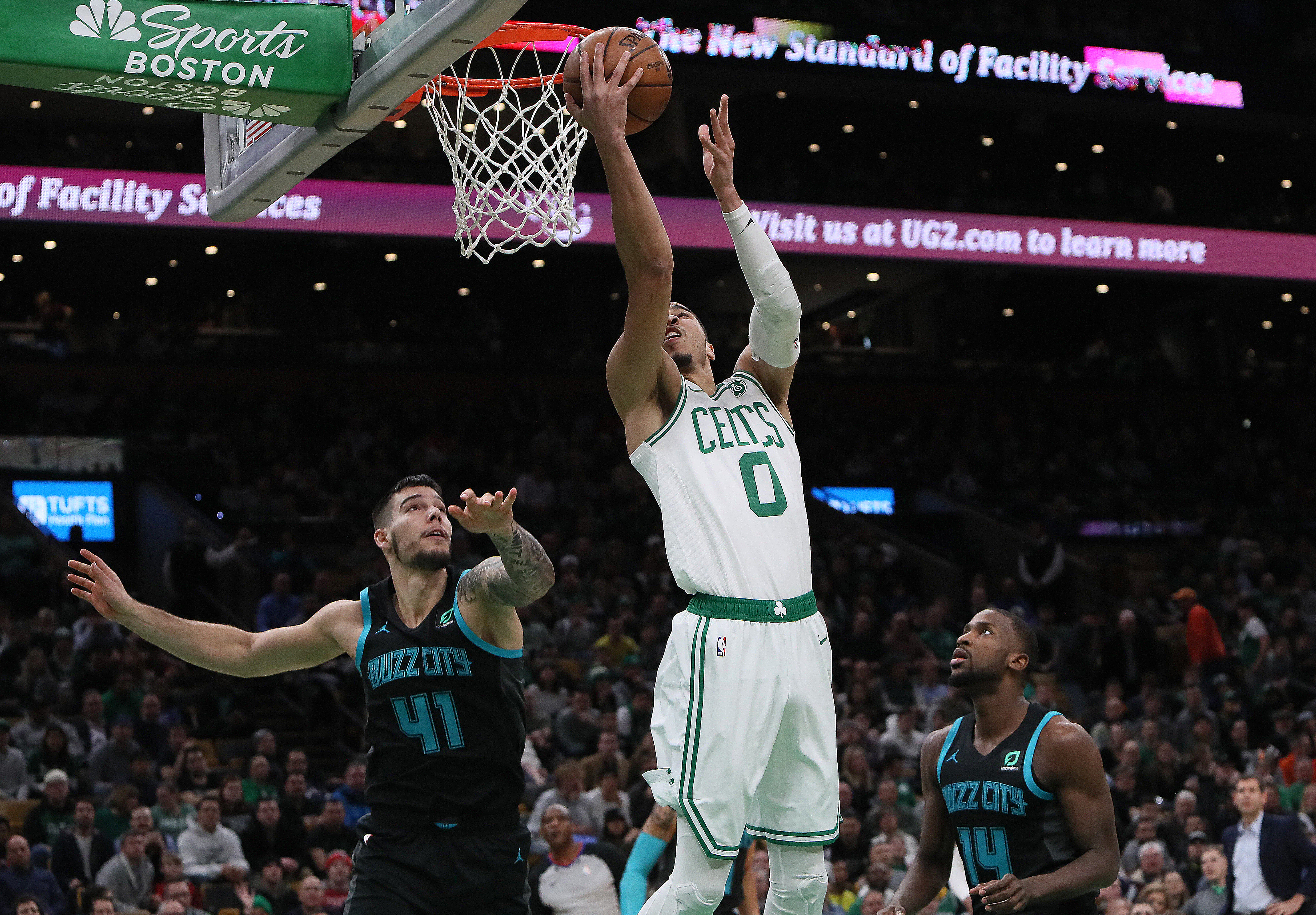 Jayson Tatum puts in a reverse layup in the first quarter for 2 of his 20 points.