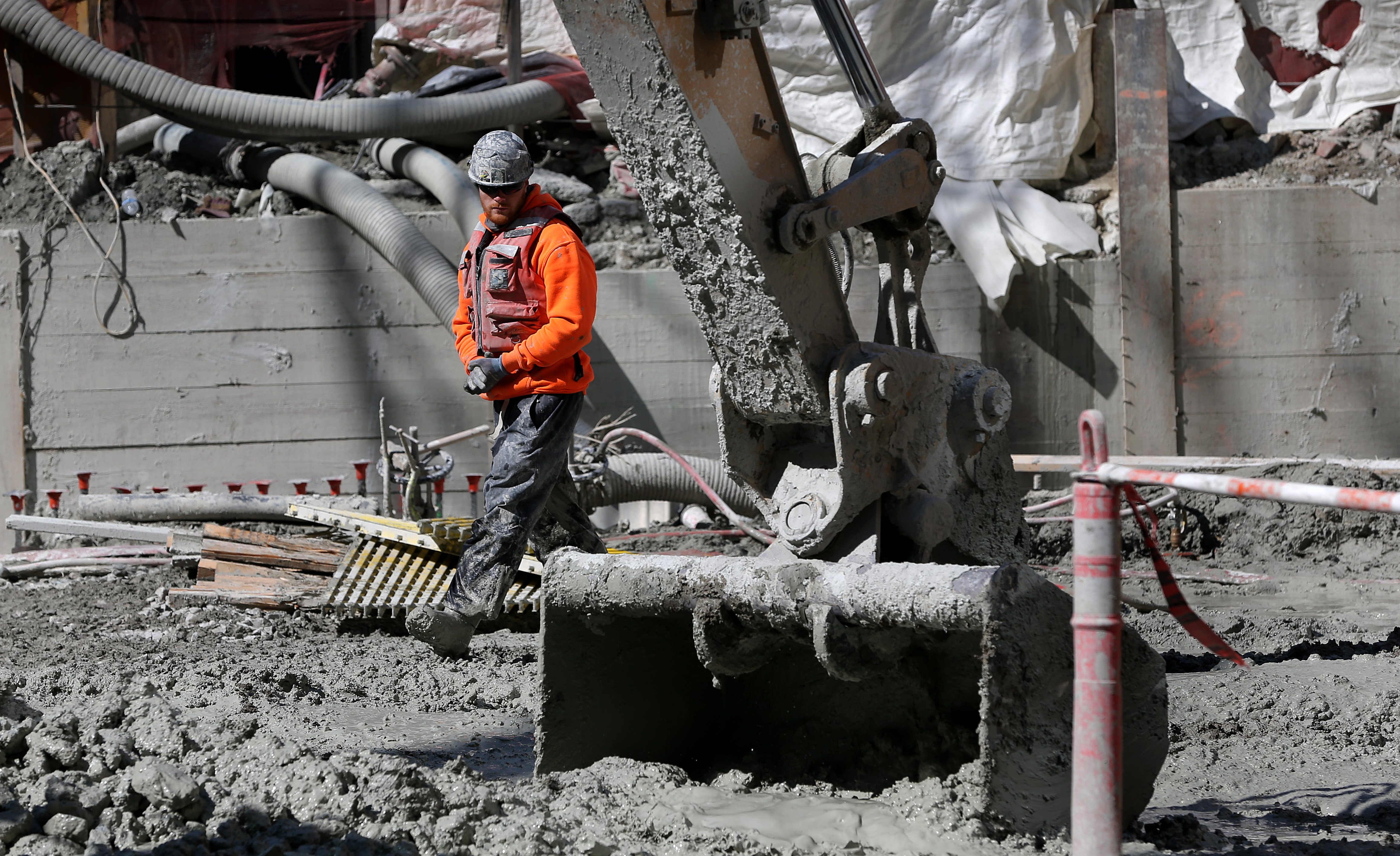 Construction crews make sure to wash the mud from their boots and equipment before exiting the site.