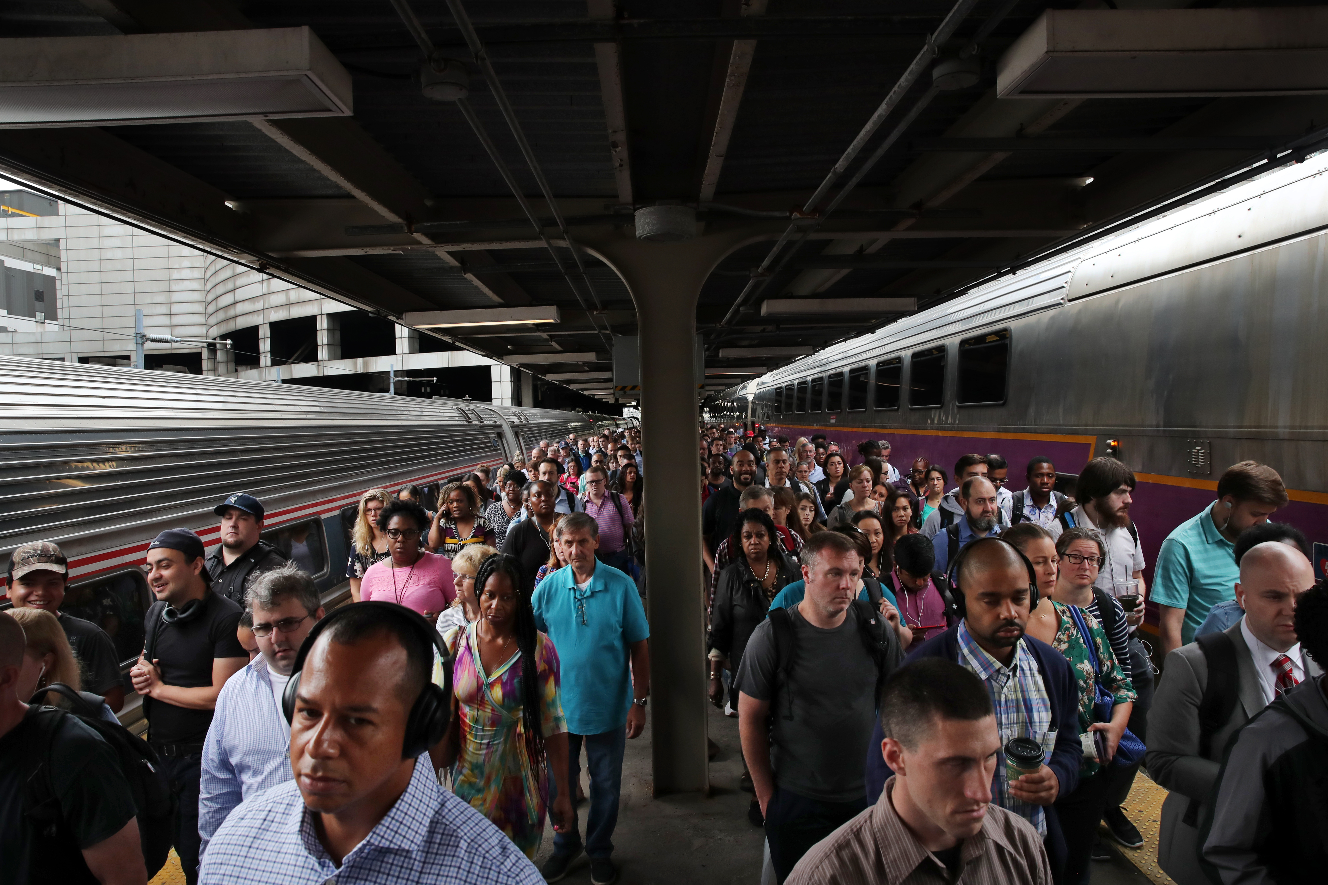 Commuters crowd into South Station in July 2019.