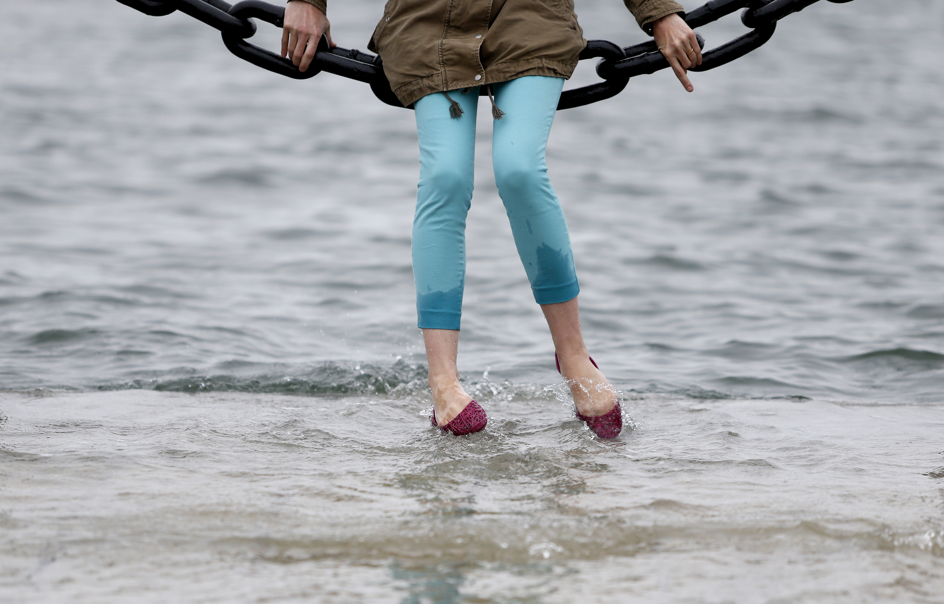 Kristin Poch of Wellesley dipped her toes in the water at Long Wharf.