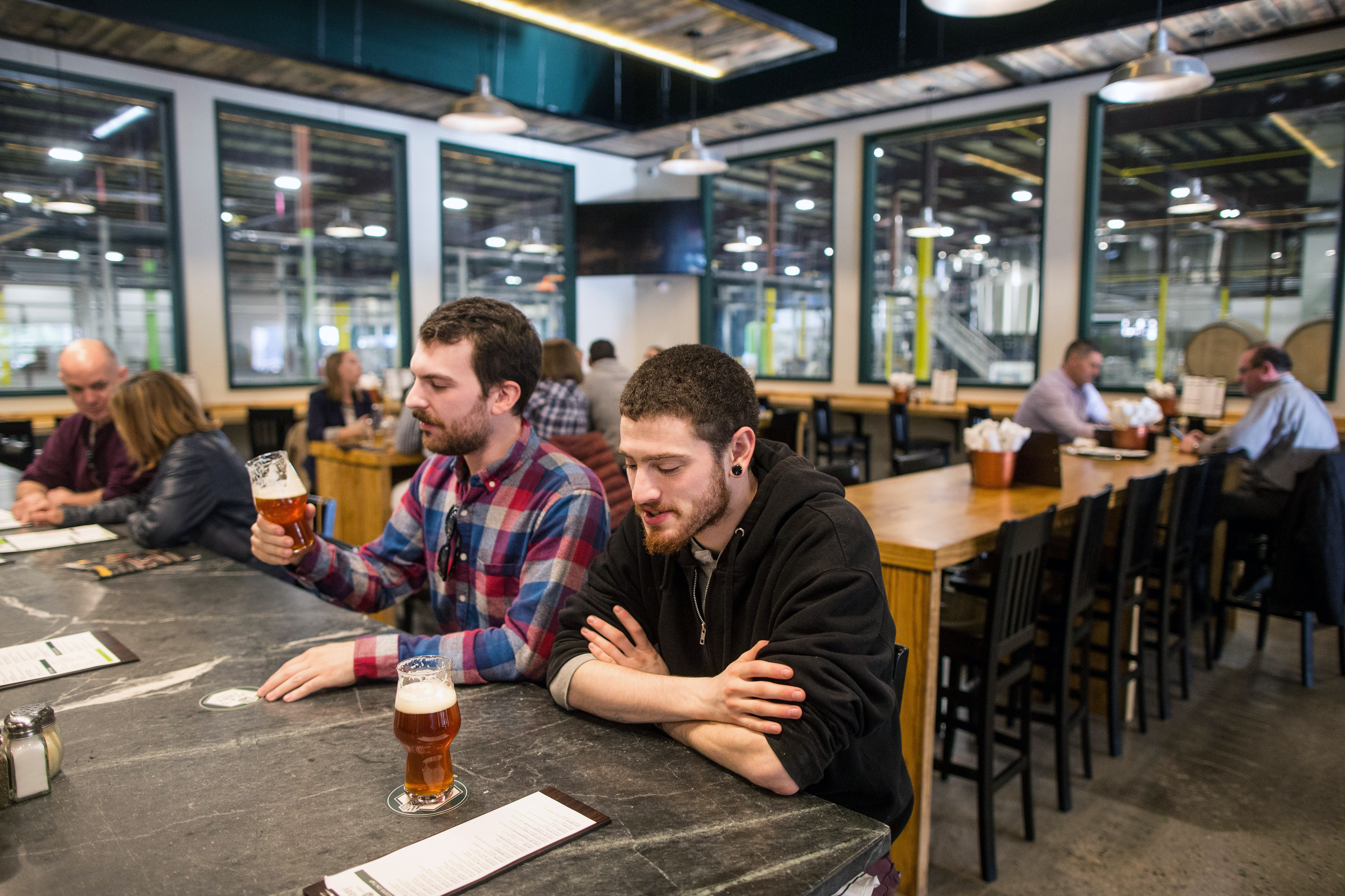Customers Alex Upton and Ben Chapin enjoyed a brew at the new Jack’s Abby in Framingham.