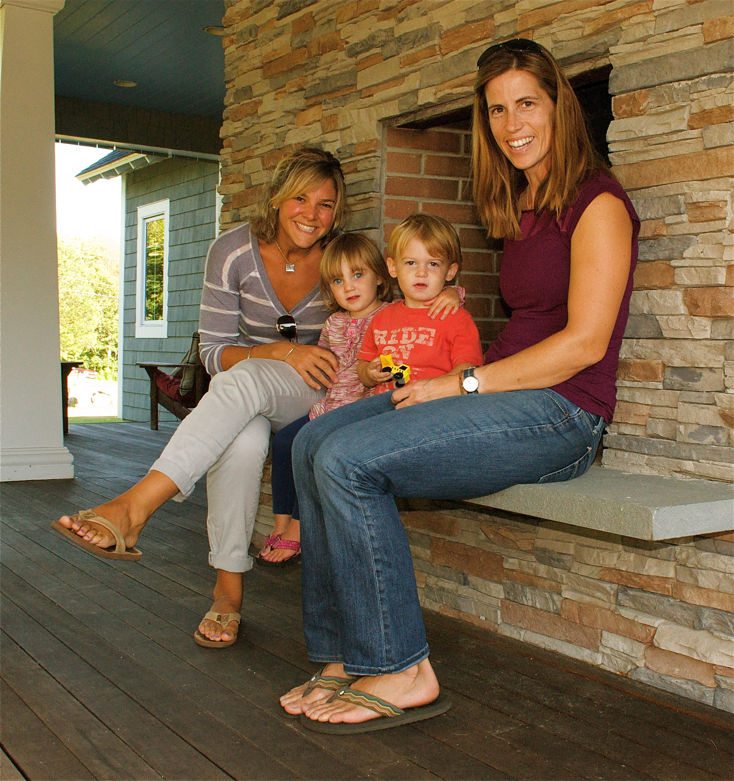 Katie Comtois (left), and Steph Murray with their children.