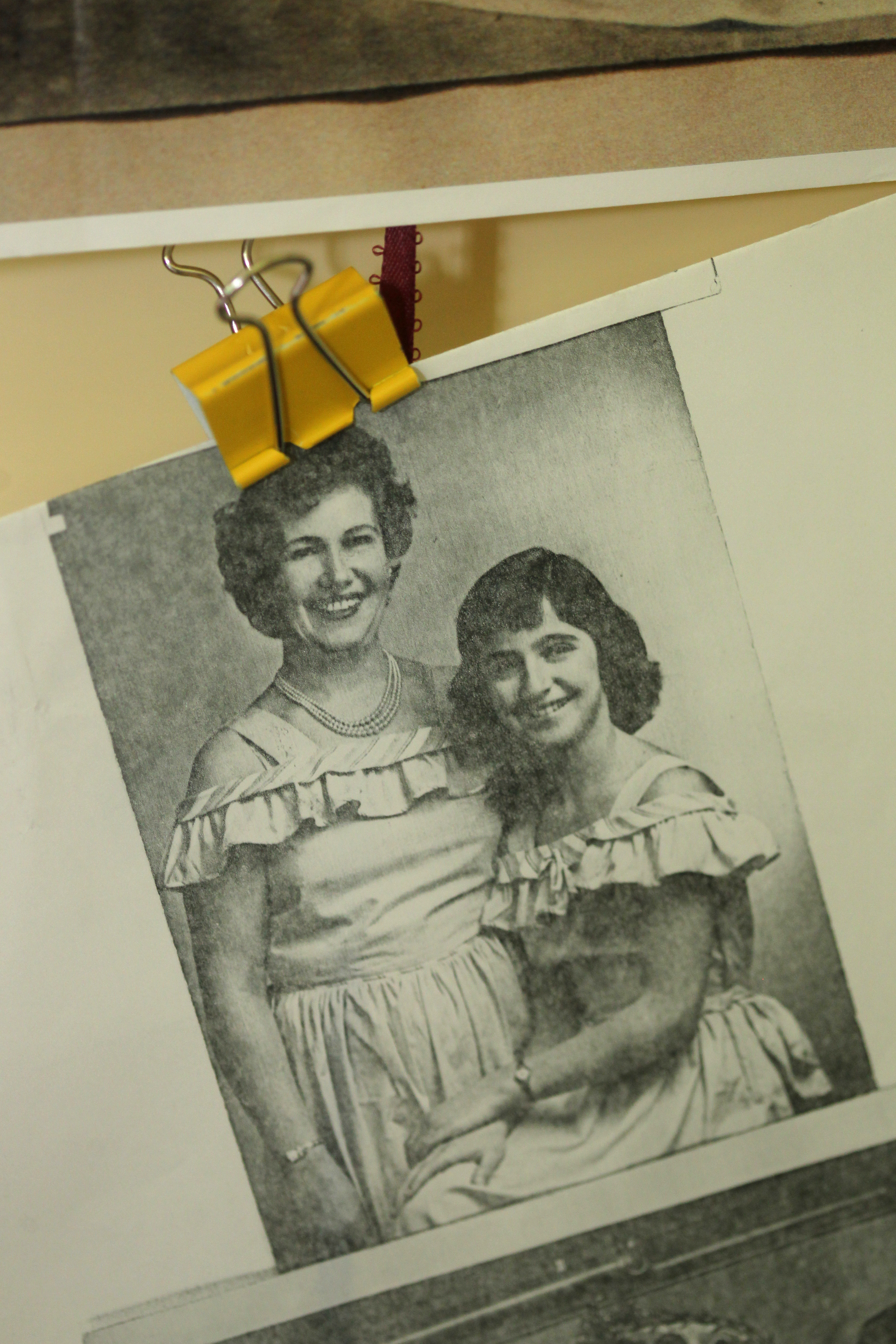 A photo of her mother and grandmother that she keeps near her desk.