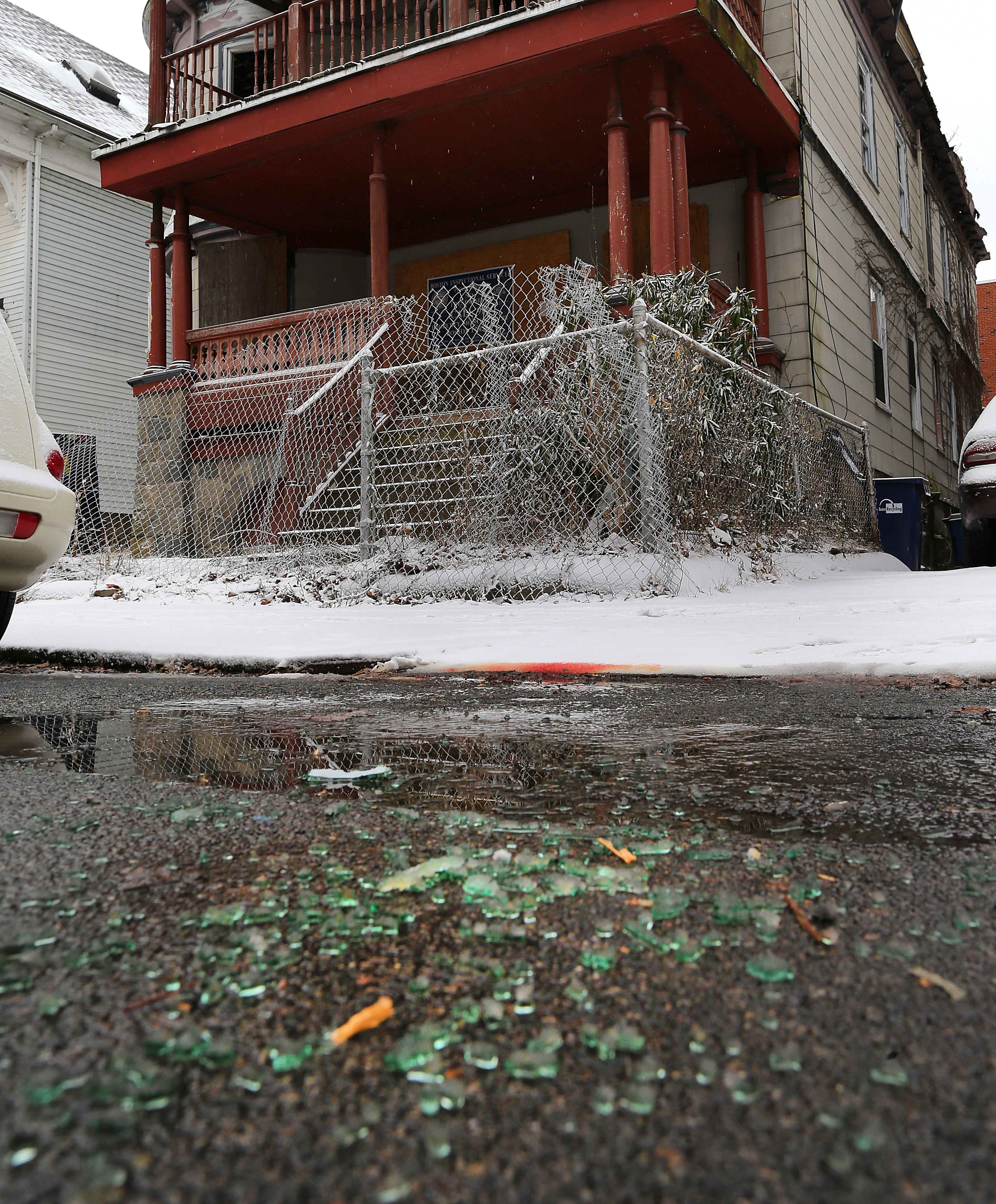 Broken car window glass and blood was seen on Harrishof Street where Alex DoSouto was killed.