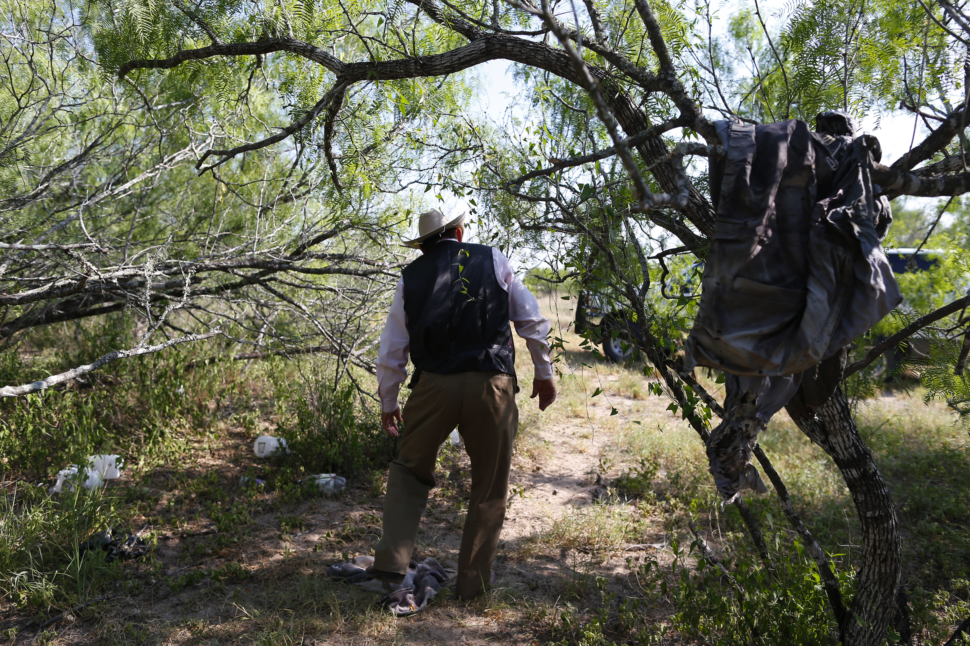 Rancher Lavoyger Durham walked past clothing left behind by immigrants. Last year, Durham was rounding up cattle when he found a body on his ranch.